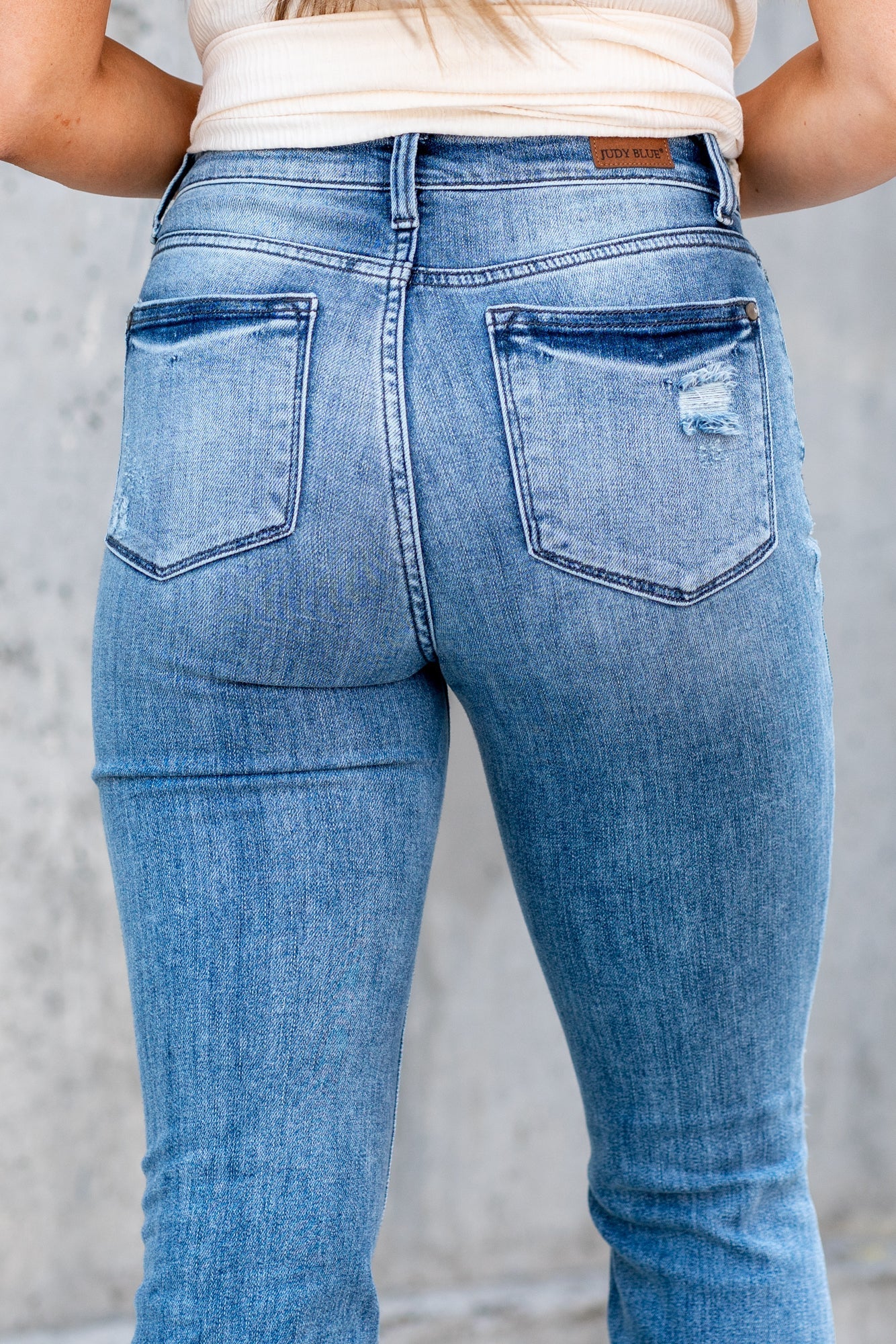 Judy Blue Boot cuts are back in style and this cute high-rise is a perfect fit! With a medium blue whiskered wash, these are versatile and stretchy denim you will love. Color: Medium Blue Wash Cut: Boot Cut, 32.5" Inseam* Rise: High-Rise, 10.5" Front Rise* Material: 93% Cotton / 6% Polyester / 1% Spandex Machine Wash Separately In Cold Water Stitching: Classic Fly: Zipper Style #: JB82405 | 82405 Contact us for any additional measurements or sizing.