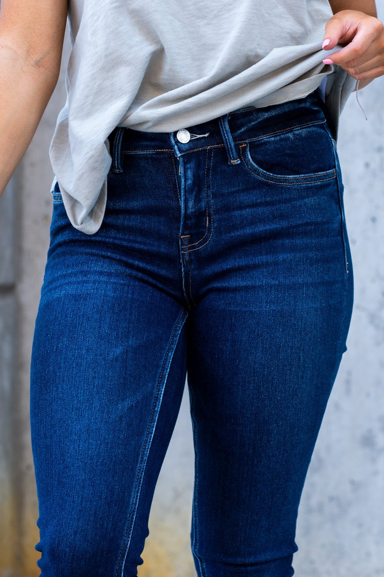 VERVET by Flying Monkey Jeans This comfortable stretchy denim has a calf-hugging fit, fray hem bottom, and zipper with a distressed hem. Skinny Cut, 30" Inseam* Mid Rise, 9" Front Rise* 98% COTTON, 2% POLYESTER Machine Wash Separately In Cold Water Stitching: Classic Fly: Zipper Style #: V2159D Contact us for any additional measurements or sizing.