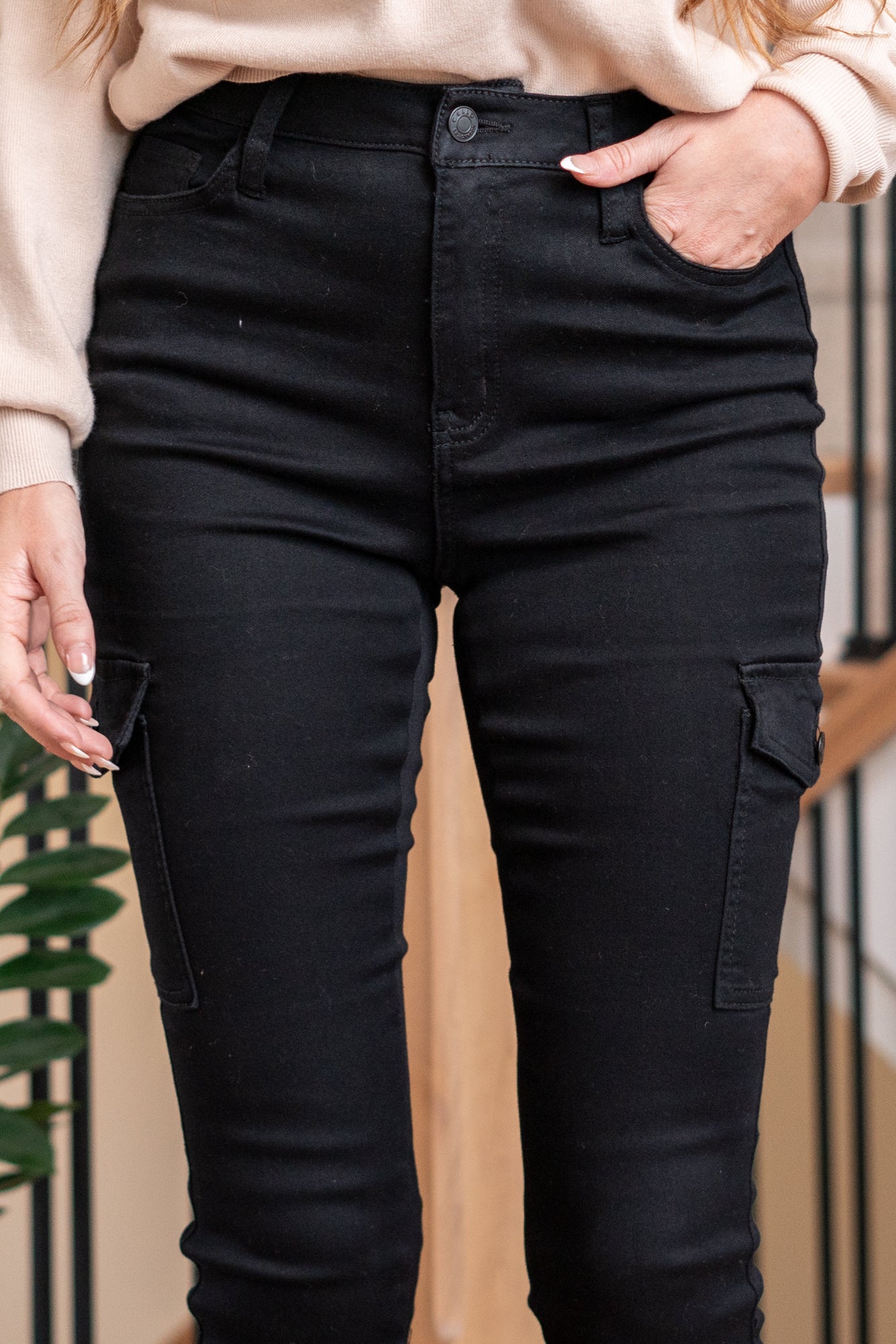 Cello Jeans Elevate your style with these High Rise Cargo Skinny Jeans in sleek black. Crafted from stretch fabric, they offer both comfort and a flattering fit. The cargo pockets bring a trendy touch to your outfit. Cut: Skinny, 29" Inseam* Rise:-Rise, 10" Front Rise* Color: Black 78% Cotton 20% Polyester 2% Spandex Fly: Zipper Style #: AM19021BLK