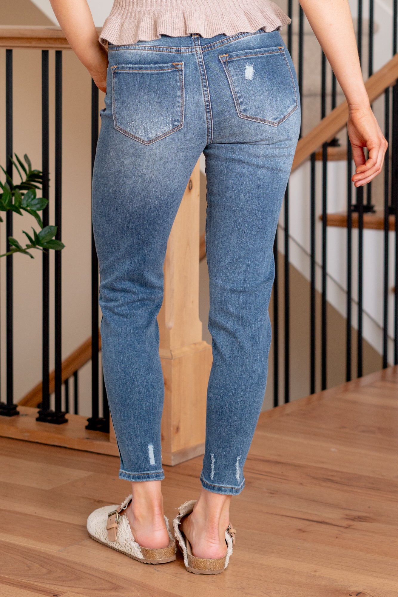 KanCan Jeans Introducing the Ellington High-Rise Ankle Skinny Jeans, your go-to classic skinnies for any occasion. These jeans strike the perfect balance with just the right amount of distress, slit hems, and fading and whiskering details for that lived-in appeal. The classic five-pocket design ensures practicality, and the button fly closure adds a timeless touch. Complete with silver-colored hardware, these jeans are ready to be dressed up or down, making them a versatile addition to your wardrobe.