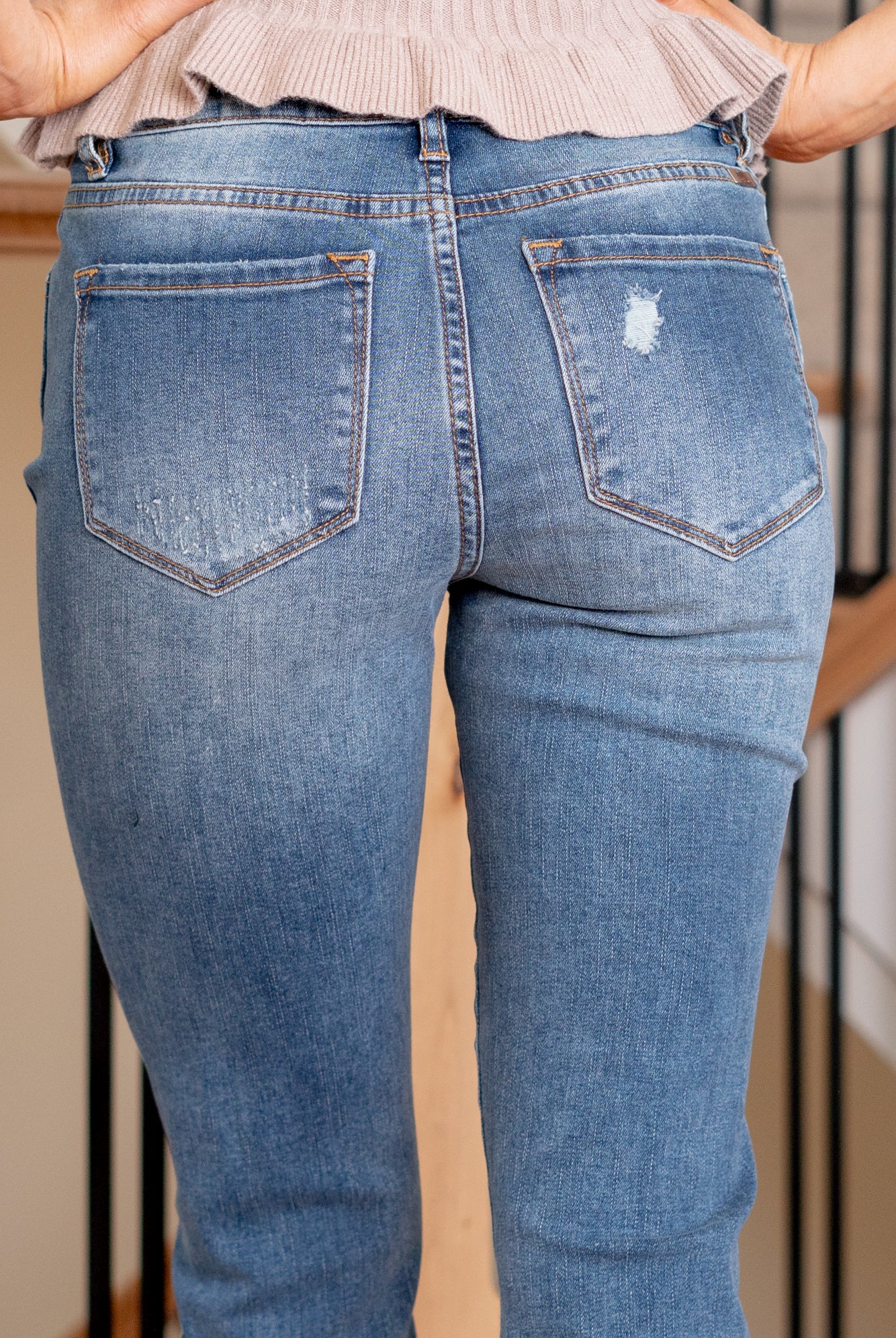 KanCan Jeans Introducing the Ellington High-Rise Ankle Skinny Jeans, your go-to classic skinnies for any occasion. These jeans strike the perfect balance with just the right amount of distress, slit hems, and fading and whiskering details for that lived-in appeal. The classic five-pocket design ensures practicality, and the button fly closure adds a timeless touch. Complete with silver-colored hardware, these jeans are ready to be dressed up or down, making them a versatile addition to your wardrobe.