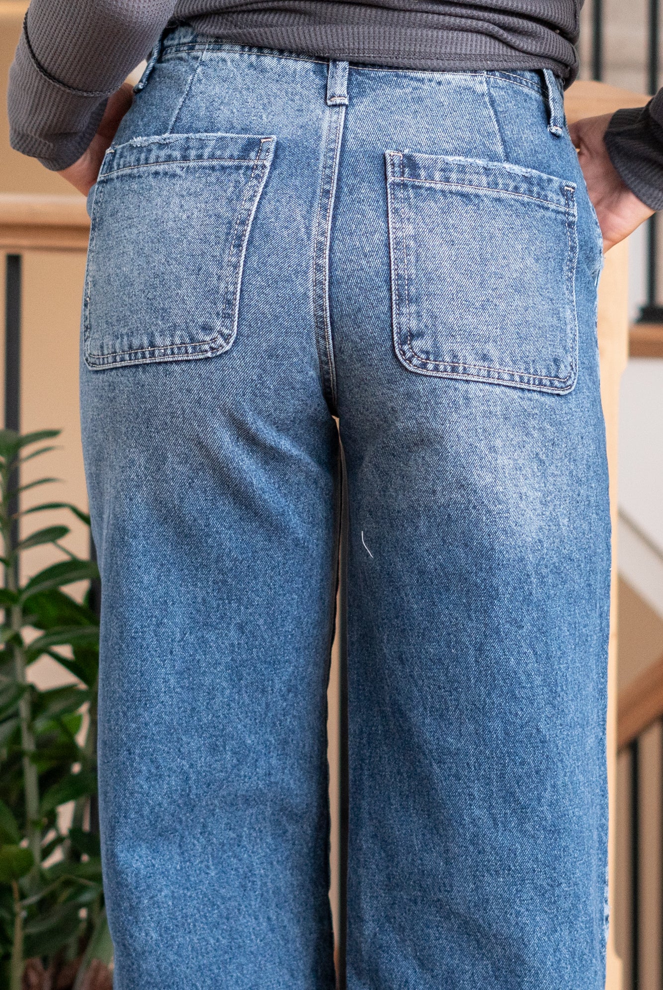 KanCan Jeans Ultra High Rise 90s Wide Leg Jeans, a nod to the iconic '90s style. While they feature a rigid stretchiness level, these jeans offer a unique design with a hidden button fly, a dart on the back waist, and front slant pockets. The one-inch wide hem adds a trendy twist to complete the look. Color: Dark Wash Cut: FIT, 30" Inseam* Rise:-Rise, 11 1/2" Front Rise* Material: 100% Cotton, Rigid Stitching: Classic Fly: Button Fly Style #: KC7948D