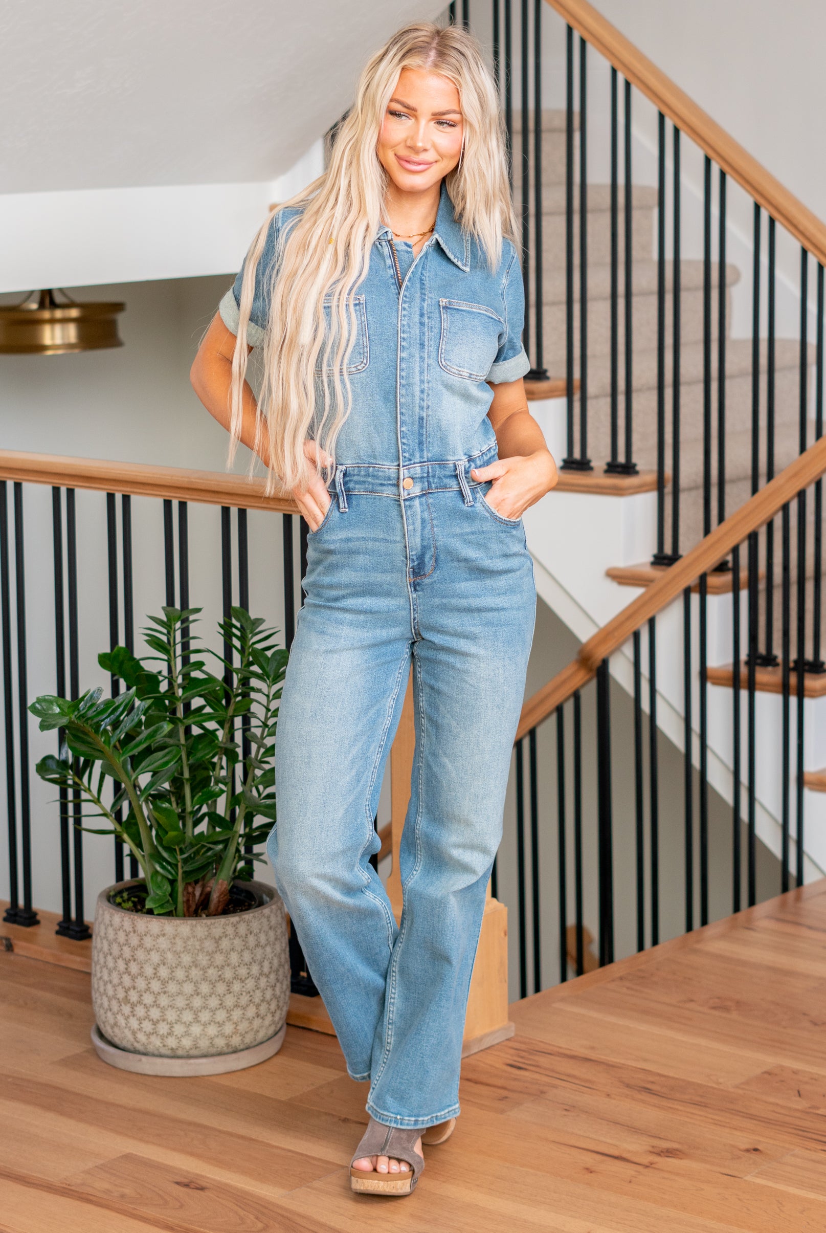 Judy Blue This jumpsuit features a flattering high waist and a chic straight fit, complemented by a medium wash for a timeless look. Embrace both fashion and functionality in this on-trend piece designed for ultimate comfort and style. Elevate your wardrobe with the Aspen jumpsuit, the ideal choice for a stylish and confident statement. Color: Medium Wash Cut: Straight, 32" Inseam* Rise: -Rise, 14" Front Rise* Material: 94% Cotton / 5% Polyester / 1% Spandex Stitching: Classic Fly: Zipper Style #: 88722PL