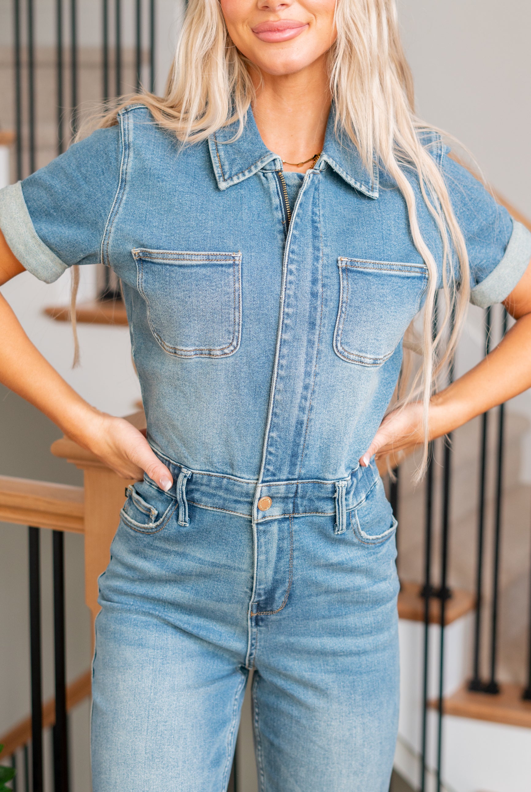 Judy Blue This jumpsuit features a flattering high waist and a chic straight fit, complemented by a medium wash for a timeless look. Embrace both fashion and functionality in this on-trend piece designed for ultimate comfort and style. Elevate your wardrobe with the Aspen jumpsuit, the ideal choice for a stylish and confident statement. Color: Medium Wash Cut: Straight, 32" Inseam* Rise: -Rise, 14" Front Rise* Material: 94% Cotton / 5% Polyester / 1% Spandex Stitching: Classic Fly: Zipper Style #: 88722PL