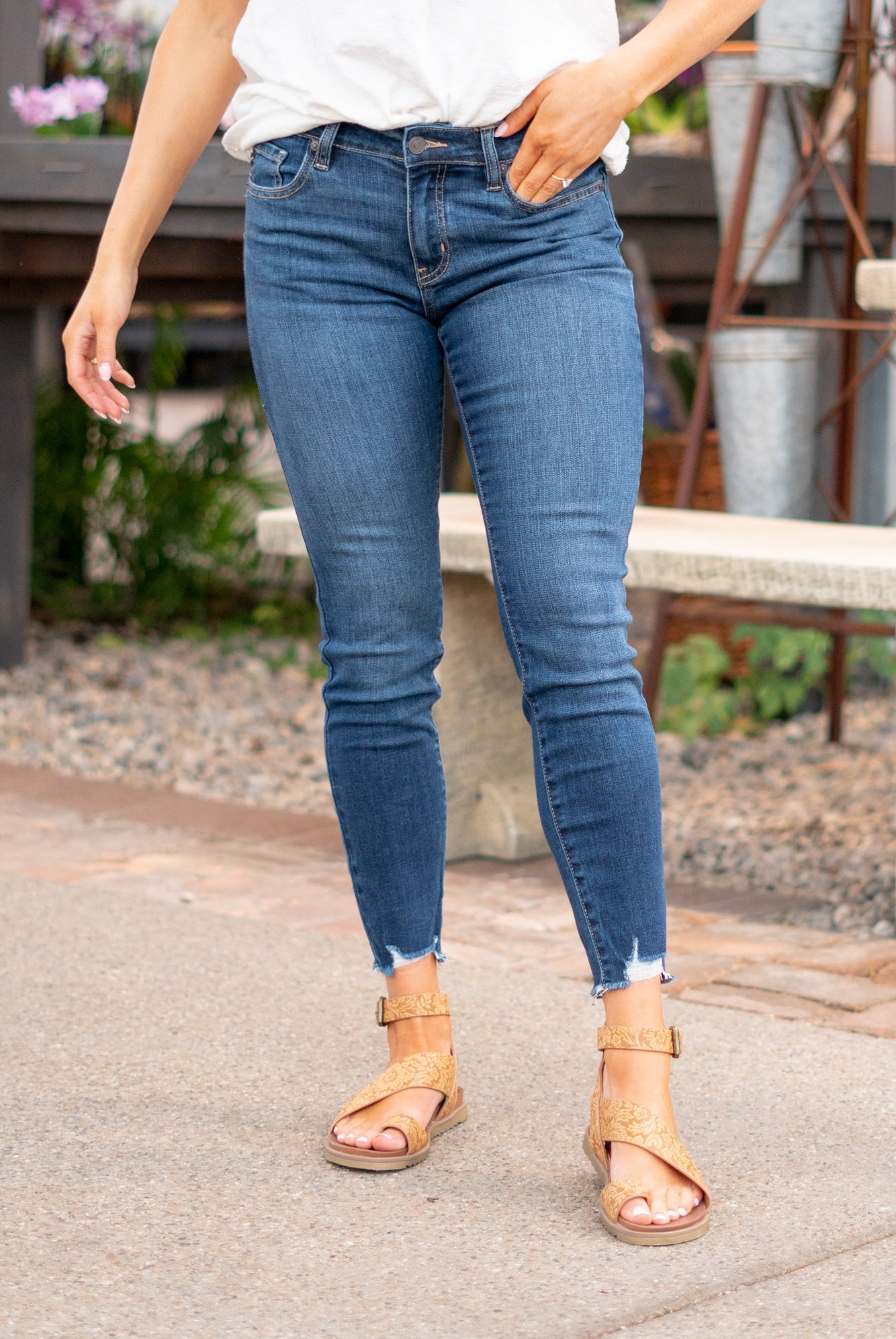 KanCan Jeans Color: Dark Wash Cut: Skinny, 27" Inseam* Rise: Mid-Rise, 9" Front Rise* 74% COTTON, 10% RAYON, 15% POLYESTER, 1% SPANDEX Stitching: Classic Fly: Zipper Style #: KC20009D Contact us for any additional measurements or sizing. *Measured on the smallest size, measurements may vary by size. Jacquelyn wears a size 25 in jeans, a small in tops, and 6.5 in shoes. She is wearing size 25 in these jeans.