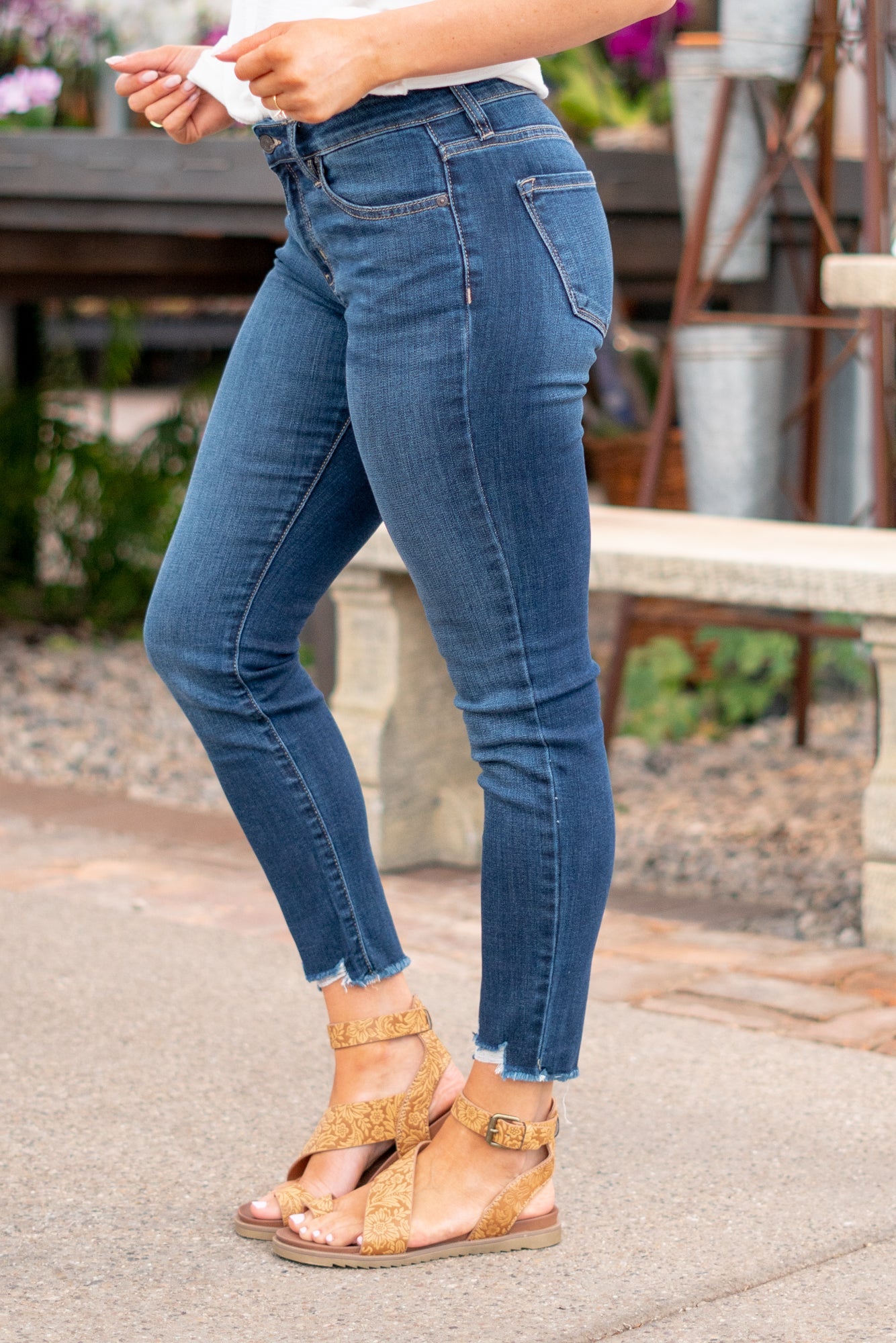 KanCan Jeans Color: Dark Wash Cut: Skinny, 27" Inseam* Rise: Mid-Rise, 9" Front Rise* 74% COTTON, 10% RAYON, 15% POLYESTER, 1% SPANDEX Stitching: Classic Fly: Zipper Style #: KC20009D Contact us for any additional measurements or sizing. *Measured on the smallest size, measurements may vary by size. Jacquelyn wears a size 25 in jeans, a small in tops, and 6.5 in shoes. She is wearing size 25 in these jeans.