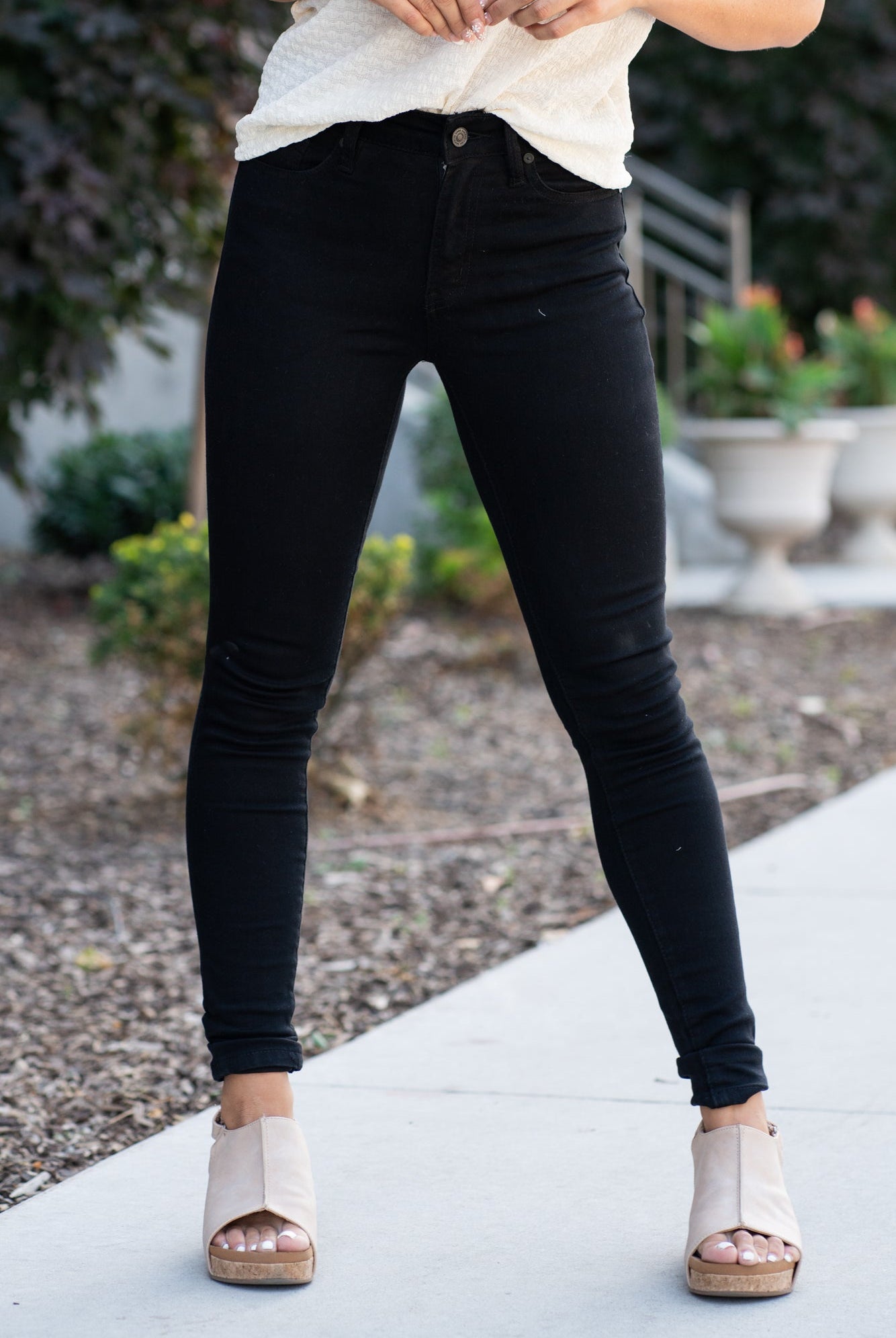 KanCan Jeans These are the staple black skinny jeans from KanCan. Collection: Core Style Color: Black Cut: Ankle Skinny, 28" Inseam Rise: High-Rise, 9.5" Front Rise Material: 65% Cotton 33% Rayon 2% Elastane Stitching: Classic Fly: Zipper Style #: KC6009BK Contact us for any additional measurements or sizing *Measured on the smallest size, measurements may vary by size. Alyssa wears a size 25 in jeans, a small in tops, and 8 in shoes. She is wearing size 3 in these jeans.