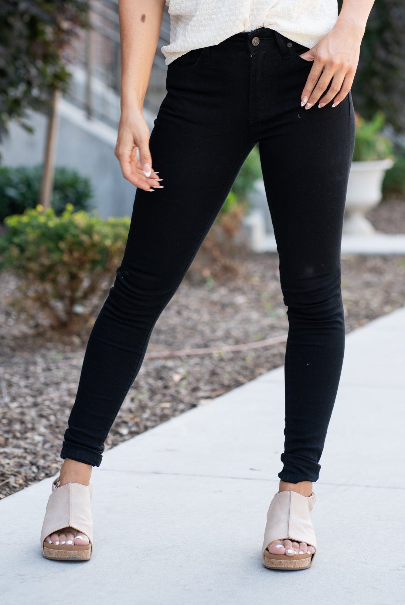 KanCan Jeans These are the staple black skinny jeans from KanCan. Collection: Core Style Color: Black Cut: Ankle Skinny, 28" Inseam Rise: High-Rise, 9.5" Front Rise Material: 65% Cotton 33% Rayon 2% Elastane Stitching: Classic Fly: Zipper Style #: KC6009BK Contact us for any additional measurements or sizing *Measured on the smallest size, measurements may vary by size. Alyssa wears a size 25 in jeans, a small in tops, and 8 in shoes. She is wearing size 3 in these jeans.