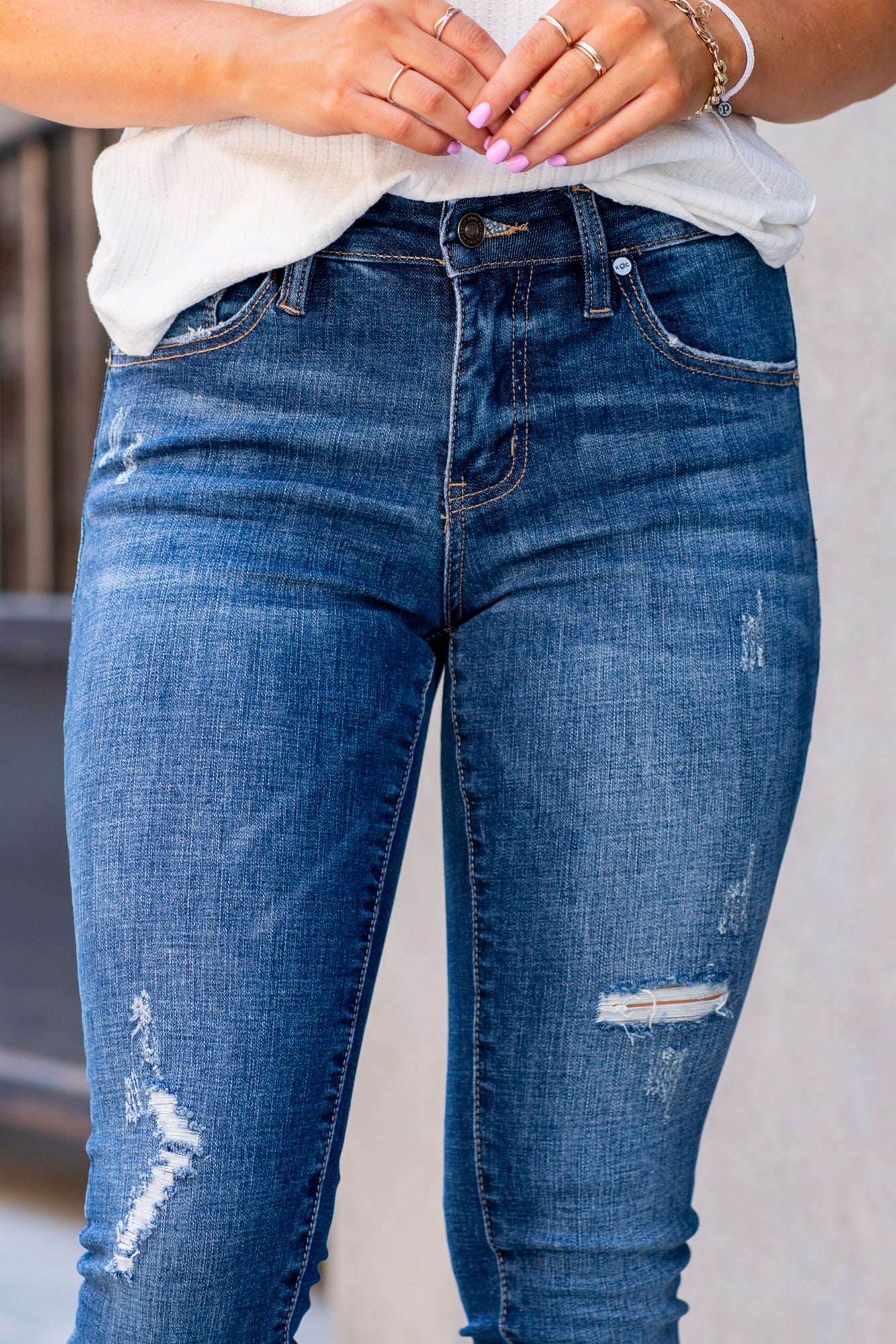 Kan Can Jeans Color: Dark Wash Cut: Ankle Skinny, 27" Inseam* Rise: Mid-Rise, 8.5" Front Rise* Material: 98% COTTON 2% SPANDEX Machine Wash Separately In Cold Water Stitching: Classic Fly: Zipper Style #: KC6204D Contact us for any additional measurements or sizing.