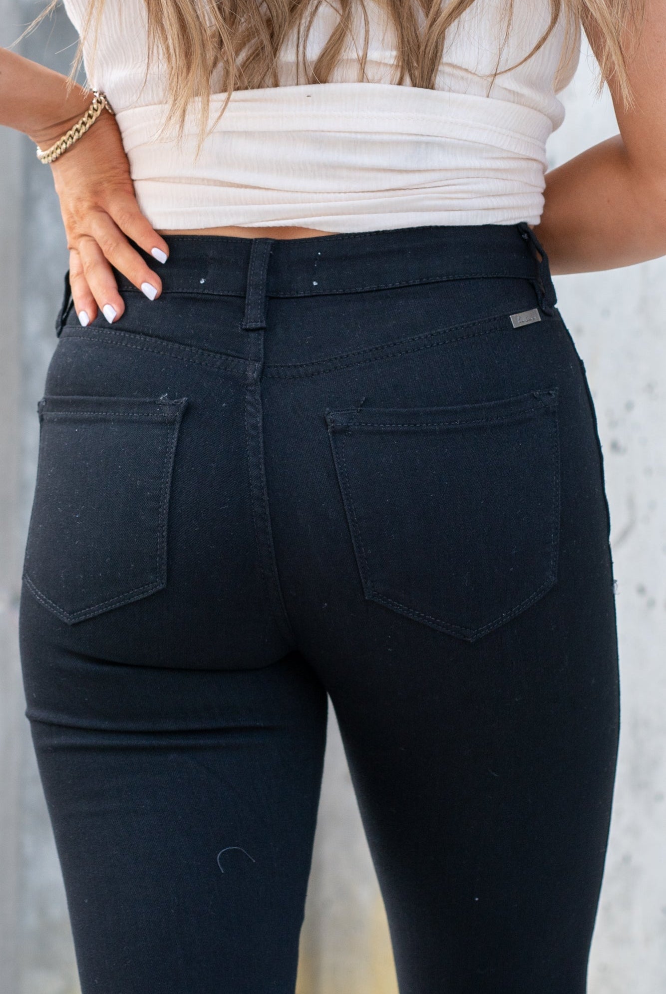KanCan Jeans These high rise medium wash skinny jeans have a spilt fray hem and fit above the ankles so you can show off you sandals this summer. Color: Black Cut: Skinny, 26.5" Inseam Rise: High-Rise, 10.5" Front Rise 72%COTTON, 25% POLYESTER, 3% SPANDEX Stitching: Classic Fly: Zipper Style #: KC8604BBK Contact us for any additional measurements or sizing.