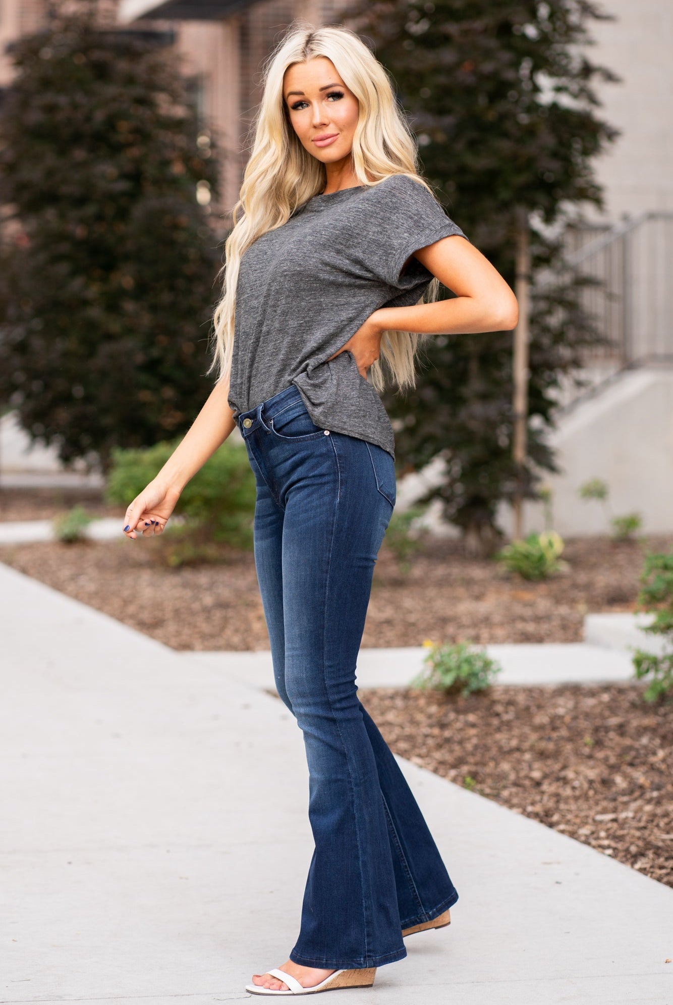 KanCan Jeans Collection: Core Style Color: Dark Wash Cut: Flare, 31.5" Inseam Rise: Mid-Rise, 9" Front Rise 54% COTTON 34% Rayon 10% POLYESTER 2% SPANDEX Fly: Zipper Style #: KC6102D-PT Contact us for any additional measurements or sizing. Haley wears a size small top, a 1 in jeans and a small in tops. She is wearing a size 24/1 in these jeans.