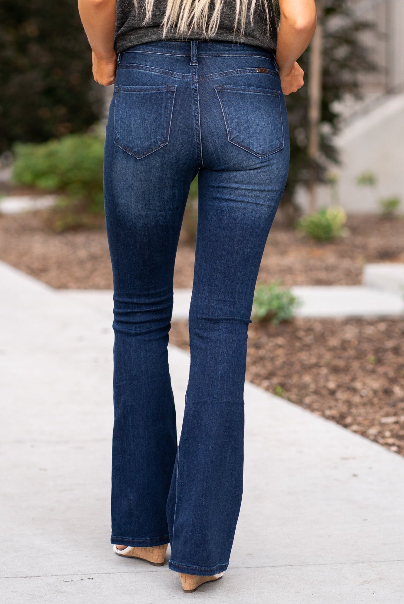 KanCan Jeans Collection: Core Style Color: Dark Wash Cut: Flare, 31.5" Inseam Rise: Mid-Rise, 9" Front Rise 54% COTTON 34% Rayon 10% POLYESTER 2% SPANDEX Fly: Zipper Style #: KC6102D-PT Contact us for any additional measurements or sizing. Haley wears a size small top, a 1 in jeans and a small in tops. She is wearing a size 24/1 in these jeans.