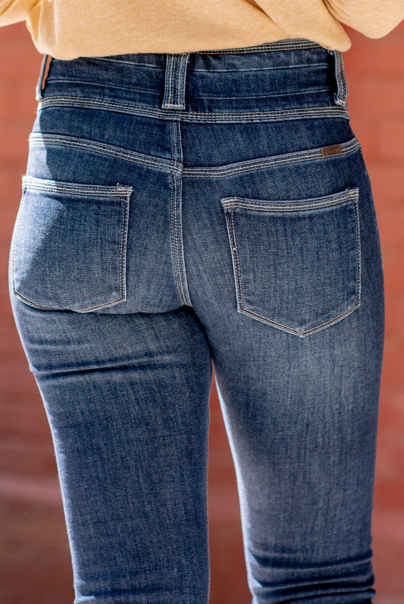 KanCan Jeans KanCan Comfort Stretch Color: Dark Wash Cut: Ankle Skinny, 28" Inseam* Rise: High Rise, 10.5" Front Rise* 68% COTTON, 30% POLYESTER, 2% SPANDEX Machine Wash Separately In Cold Water Stitching: Classic Fly: Zipper with a Triple Button Closure Style #: KC8601D Contact us for any additional measurements or sizing. *Measured on the smallest size, measurements may vary by size.