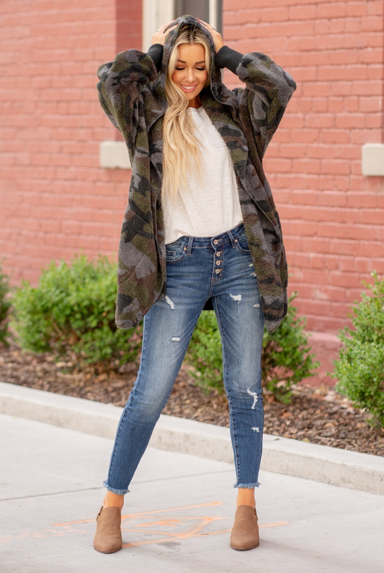 Hem & Thread This camo print is too cute. Pair with a great boyfriend denim in heels for a trendy fun look. Collection: Winter 2020 Color: Camouflage Neckline: Open Sleeve: Long 100% POLYESTER Style #: 8433F-Camo Contact us for any additional measurements or sizing.