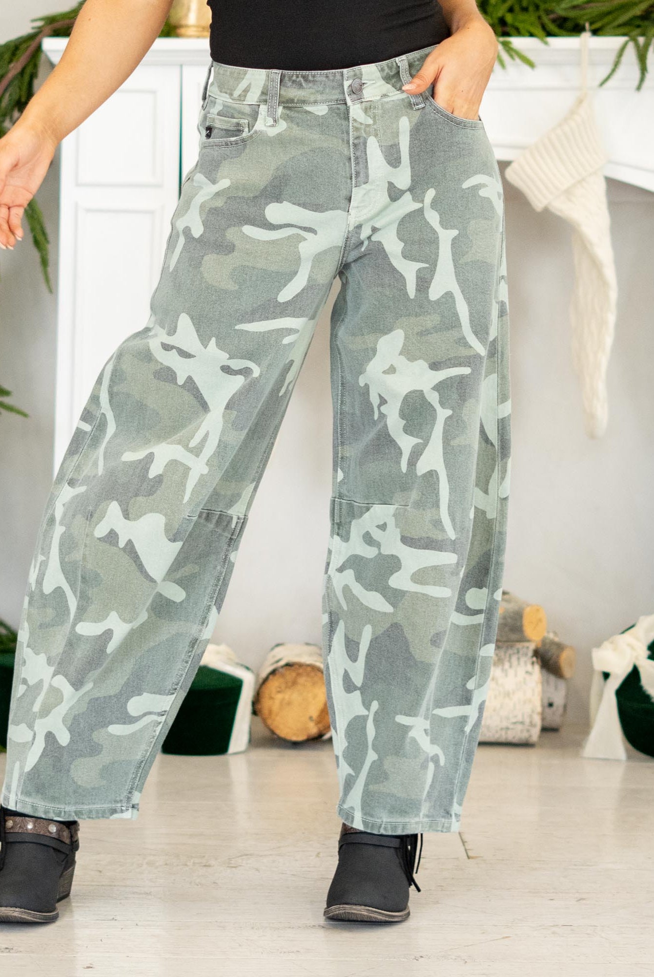 Show out in our Xena High Rise Camo Horseshoe Jeans — a bold, sculptural silhouette that instantly elevates any outfit. Designed to sit comfortably at the high rise, this horseshoe shape curves wide through the thigh, then narrows back in toward the ankle for that oversized, baggy-but-polished look everyone’s obsessed with.
The allover camo print adds a street-style twist while still feeling wearable for everyday fits. Finished with a classic single-button closure, zip fly, and traditional 5-pocket styling