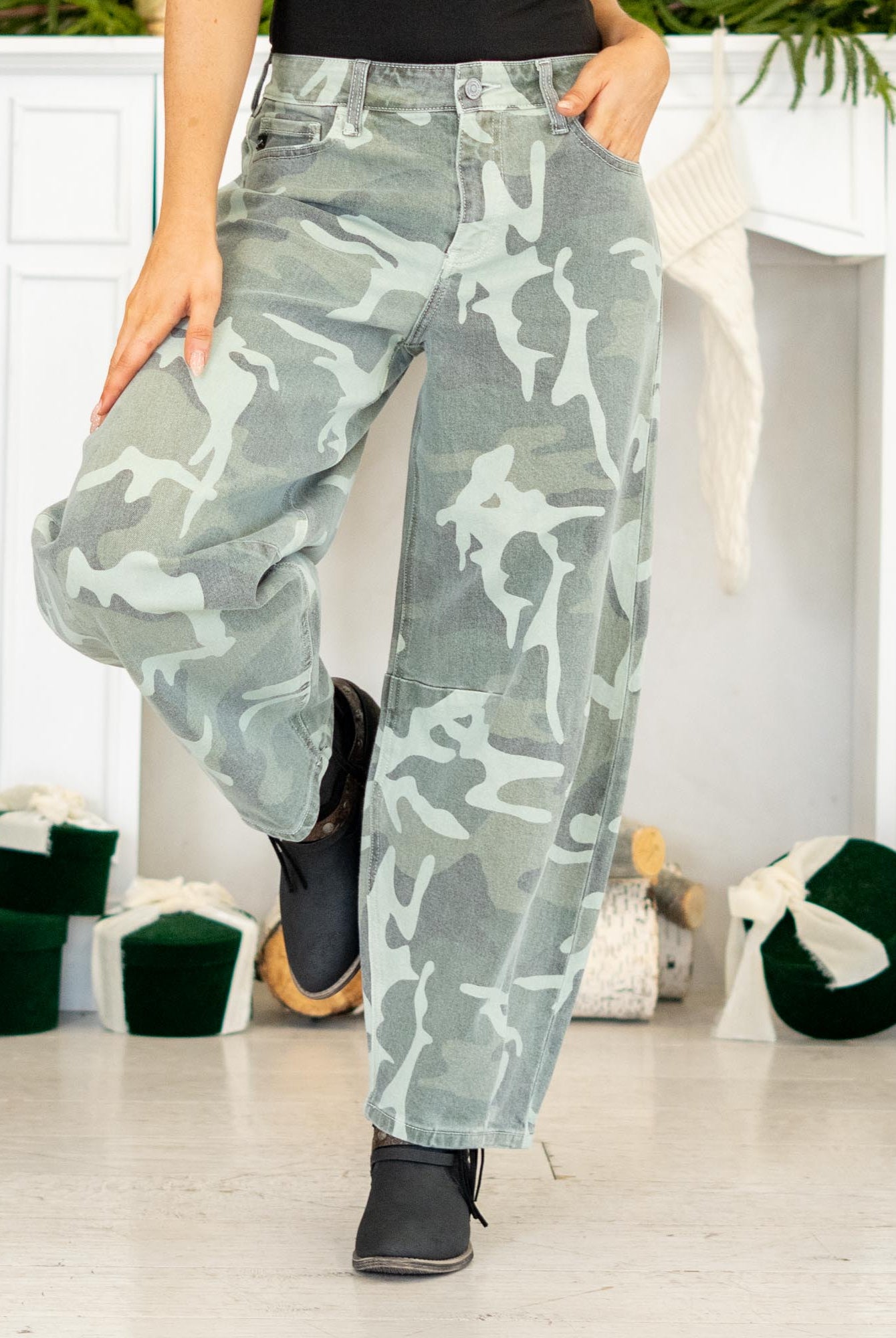 Show out in our Xena High Rise Camo Horseshoe Jeans — a bold, sculptural silhouette that instantly elevates any outfit. Designed to sit comfortably at the high rise, this horseshoe shape curves wide through the thigh, then narrows back in toward the ankle for that oversized, baggy-but-polished look everyone’s obsessed with.
The allover camo print adds a street-style twist while still feeling wearable for everyday fits. Finished with a classic single-button closure, zip fly, and traditional 5-pocket styling