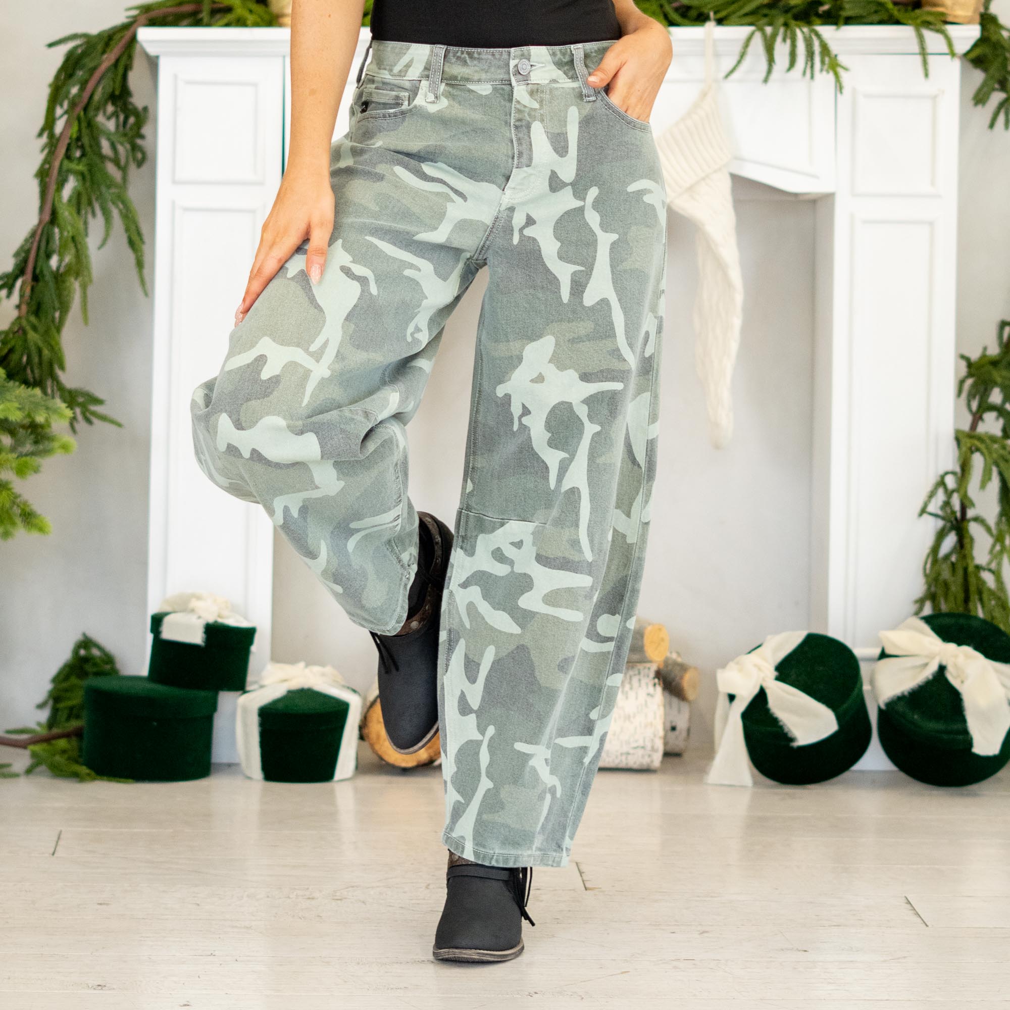Show out in our Xena High Rise Camo Horseshoe Jeans — a bold, sculptural silhouette that instantly elevates any outfit. Designed to sit comfortably at the high rise, this horseshoe shape curves wide through the thigh, then narrows back in toward the ankle for that oversized, baggy-but-polished look everyone’s obsessed with.
The allover camo print adds a street-style twist while still feeling wearable for everyday fits. Finished with a classic single-button closure, zip fly, and traditional 5-pocket styling