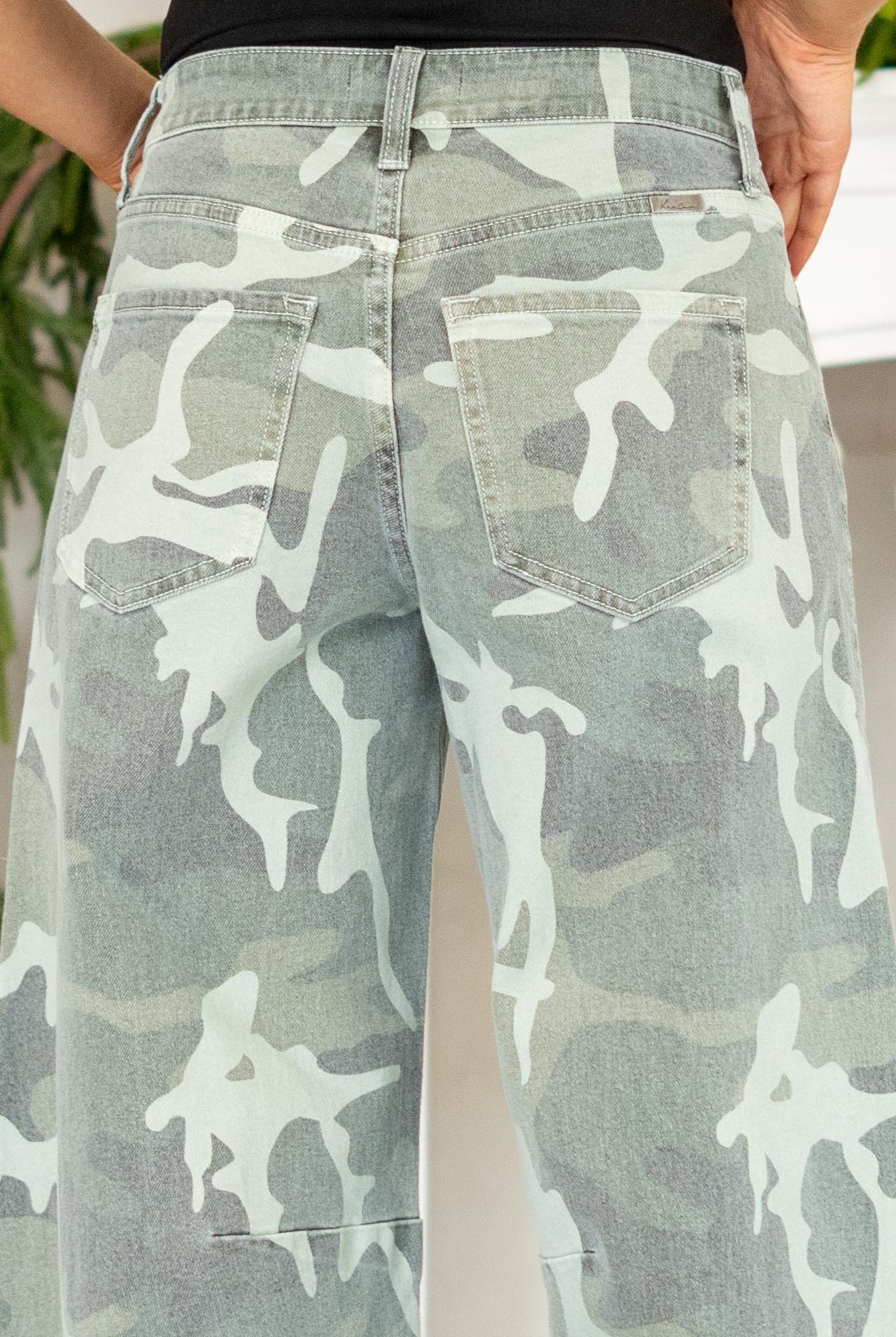 Show out in our Xena High Rise Camo Horseshoe Jeans — a bold, sculptural silhouette that instantly elevates any outfit. Designed to sit comfortably at the high rise, this horseshoe shape curves wide through the thigh, then narrows back in toward the ankle for that oversized, baggy-but-polished look everyone’s obsessed with.
The allover camo print adds a street-style twist while still feeling wearable for everyday fits. Finished with a classic single-button closure, zip fly, and traditional 5-pocket styling
