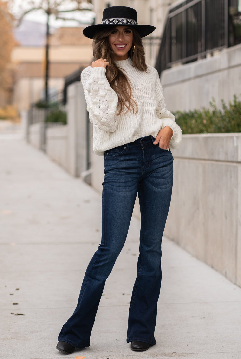 KanCan Jeans Collection: Core Style Color: Dark Wash Cut: Flare, 33.75" Inseam Rise: Mid-Rise, 9" Front Rise 54% 54% COTTON 34% Rayon 10% POLYESTER 2% SPANDEX Fly: Zipper Style #: KC6102D Contact us for any additional measurements or sizing. Taylor is 5'7" and wears a size 4 in jeans, small top and an 8.5 in shoes. She is wearing a size size 25/3 in these jeans.