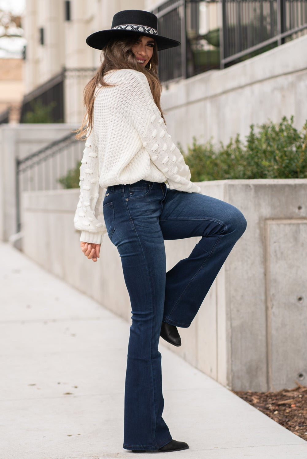 KanCan Jeans Collection: Core Style Color: Dark Wash Cut: Flare, 33.75" Inseam Rise: Mid-Rise, 9" Front Rise 54% 54% COTTON 34% Rayon 10% POLYESTER 2% SPANDEX Fly: Zipper Style #: KC6102D Contact us for any additional measurements or sizing. Taylor is 5'7" and wears a size 4 in jeans, small top and an 8.5 in shoes. She is wearing a size size 25/3 in these jeans.