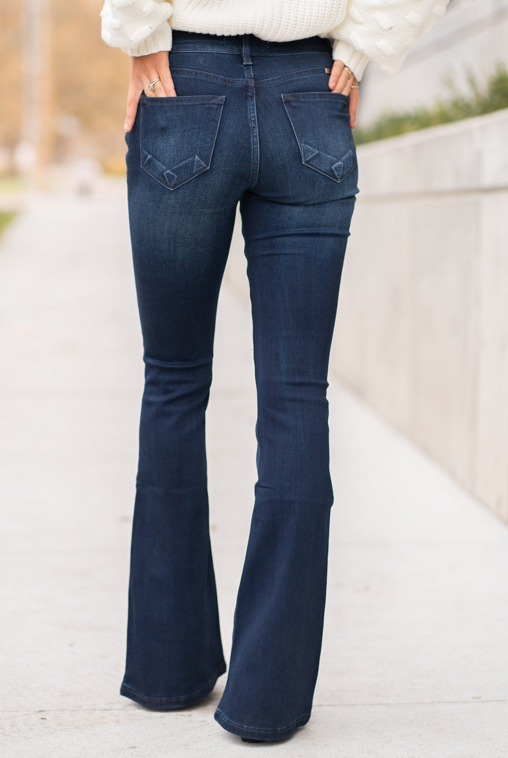KanCan Jeans Collection: Core Style Color: Dark Wash Cut: Flare, 33.75" Inseam Rise: Mid-Rise, 9" Front Rise 54% 54% COTTON 34% Rayon 10% POLYESTER 2% SPANDEX Fly: Zipper Style #: KC6102D Contact us for any additional measurements or sizing. Taylor is 5'7" and wears a size 4 in jeans, small top and an 8.5 in shoes. She is wearing a size size 25/3 in these jeans.