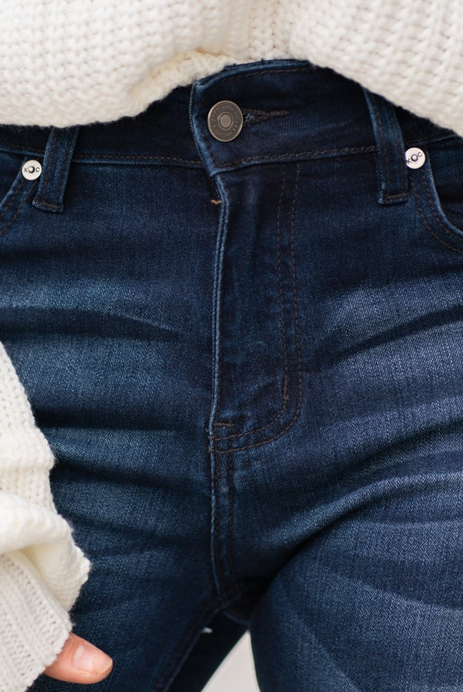 KanCan Jeans Collection: Core Style Color: Dark Wash Cut: Flare, 33.75" Inseam Rise: Mid-Rise, 9" Front Rise 54% 54% COTTON 34% Rayon 10% POLYESTER 2% SPANDEX Fly: Zipper Style #: KC6102D Contact us for any additional measurements or sizing. Taylor is 5'7" and wears a size 4 in jeans, small top and an 8.5 in shoes. She is wearing a size size 25/3 in these jeans.