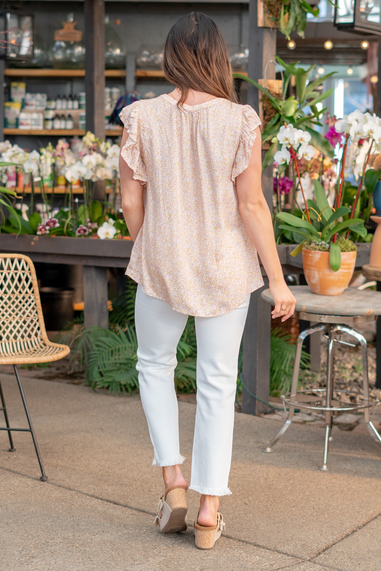 Ruffle Sleeve Top Color: Neutral Coral Neckline: Button Down Sleeve: Flutter Sleeve Material: 100% Rayon Style #: 43000T-Neutral Orange Contact us for any additional measurements or sizing. *Measured on the smallest size, measurements may vary by size.