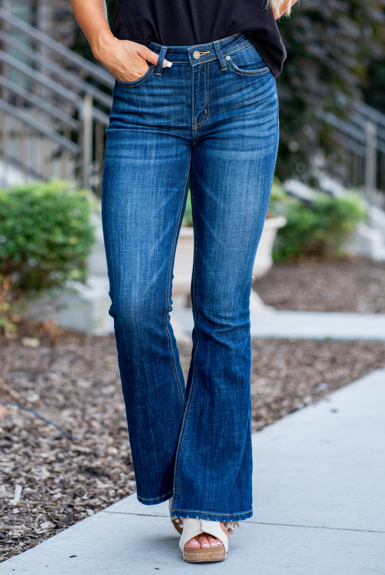 KanCan Jeans Collection: Core Style Color: Dark Wash Cut: Flare, 33.75" Inseam* Rise: Mid-Rise, 9" Front Rise* 54% 54% COTTON 34% Rayon 10% POLYESTER 2% SPANDEX Fly: Zipper Style #: KC6102LOH Contact us for any additional measurements or sizing. *Measured on the smallest size, measurements may vary by size. Cas is 5'7" and wears a size 25 in jeans, a small in tops, and 8 in shoes. She is wearing size 25 in these jeans.