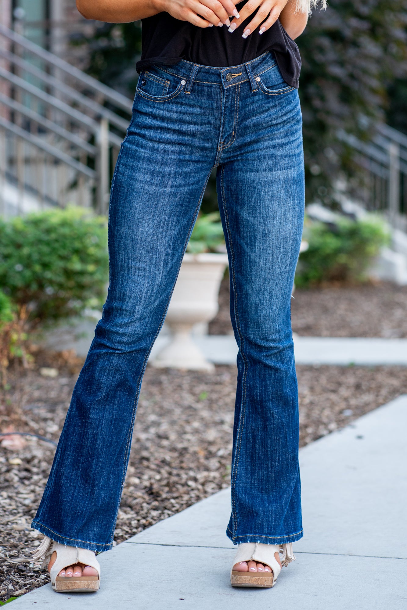 KanCan Jeans Collection: Core Style Color: Dark Wash Cut: Flare, 33.75" Inseam* Rise: Mid-Rise, 9" Front Rise* 54% 54% COTTON 34% Rayon 10% POLYESTER 2% SPANDEX Fly: Zipper Style #: KC6102LOH Contact us for any additional measurements or sizing. *Measured on the smallest size, measurements may vary by size. Cas is 5'7" and wears a size 25 in jeans, a small in tops, and 8 in shoes. She is wearing size 25 in these jeans.