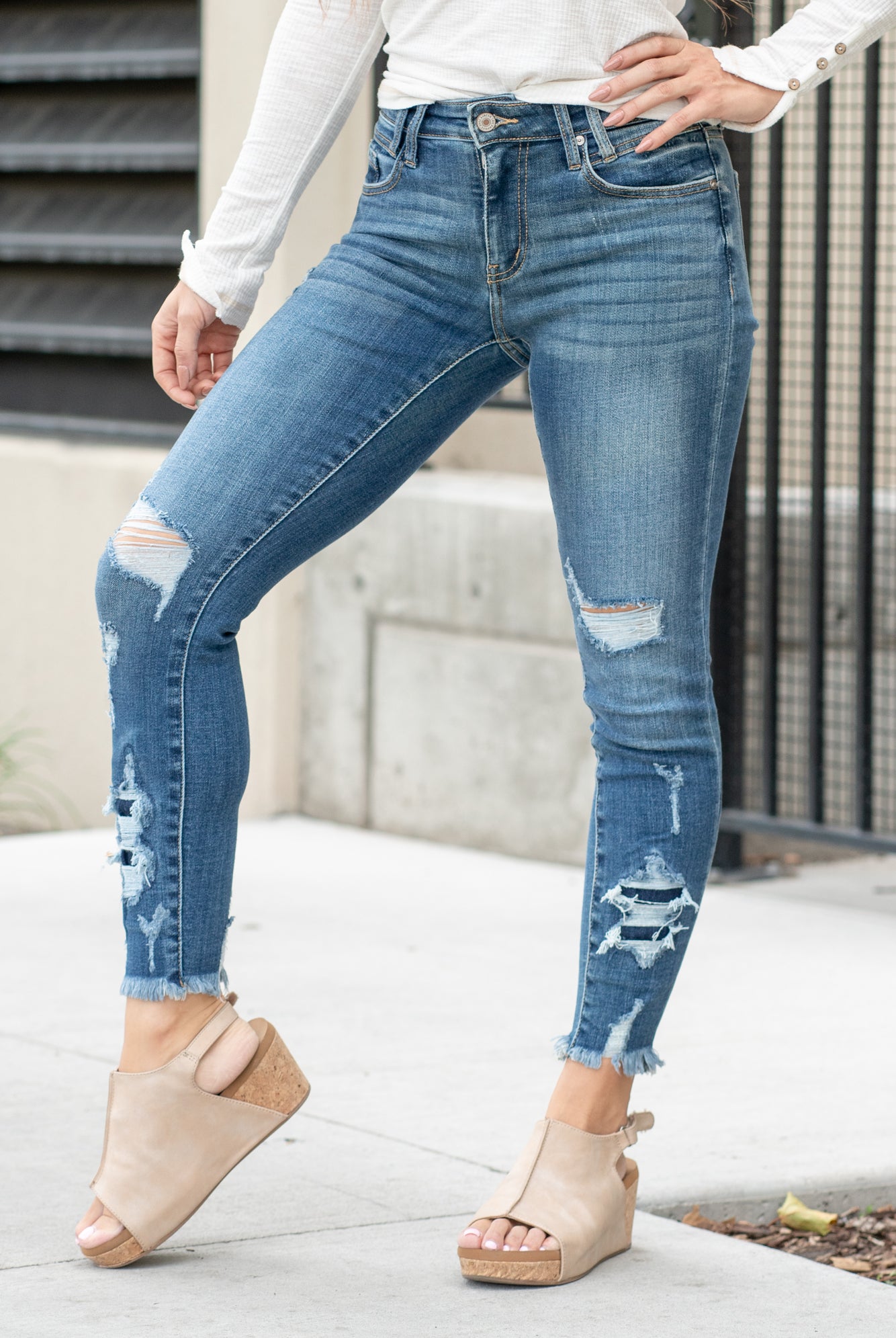 KanCan Jeans Parkersburg are KanCans ankle skinny with a mid-rise fit. These have a fitted leg with a denim patch distress and a whiskered wash in medium blue. Color: Medium Wash Ankle Skinny, 27" Inseam* Mid Rise, 9.25" Front Rise* Dyed Side Seam 93% COTTON , 6% POLYESTER , 1% SPANDEX Fly: Zipper Style #: KC2516M Contact us for any additional measurements or sizing.