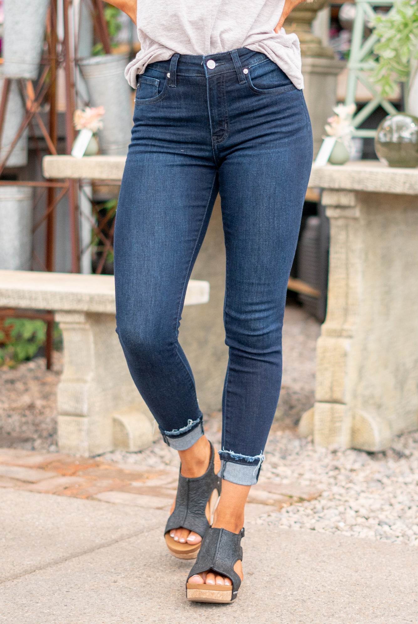 KanCan Jeans These are the ones, the classic KanCan that can be dressed up or worn casually. Pair with heels and a front tuck for a night out. Color: Dark Wash Cut: Fit Skinny, 27" Inseam Rise: High Rise, 10" Front Rise 74% COTTON, 10% RAYON, 15% POLYESTER, 1% SPANDEX Stitching: Classic Fly: Zipper Fly Style #: KC20010SD