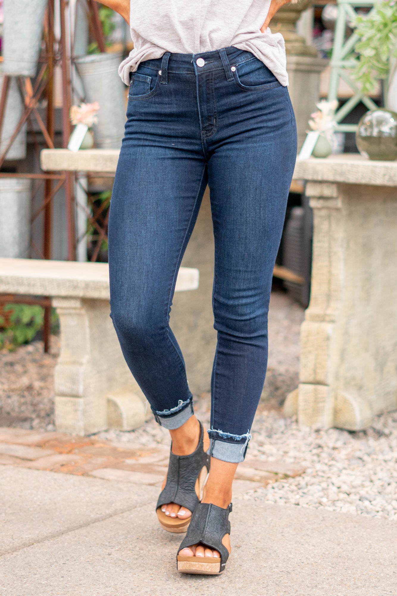 KanCan Jeans These are the ones, the classic KanCan that can be dressed up or worn casually. Pair with heels and a front tuck for a night out. Color: Dark Wash Cut: Fit Skinny, 27" Inseam Rise: High Rise, 10" Front Rise 74% COTTON, 10% RAYON, 15% POLYESTER, 1% SPANDEX Stitching: Classic Fly: Zipper Fly Style #: KC20010SD