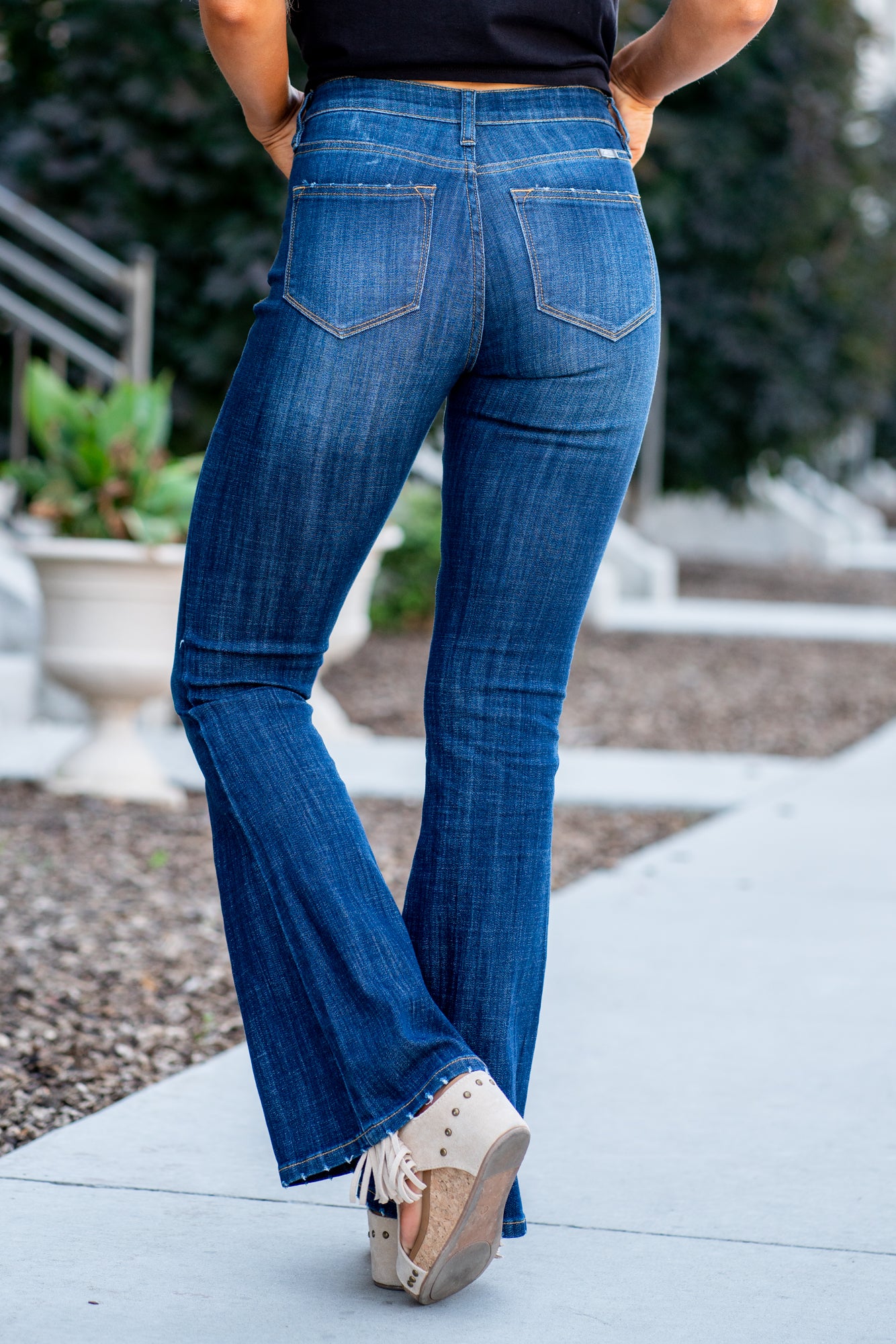 KanCan Jeans Collection: Core Style Color: Dark Wash Cut: Flare, 33.75" Inseam* Rise: Mid-Rise, 9" Front Rise* 54% 54% COTTON 34% Rayon 10% POLYESTER 2% SPANDEX Fly: Zipper Style #: KC6102LOH Contact us for any additional measurements or sizing. *Measured on the smallest size, measurements may vary by size. Cas is 5'7" and wears a size 25 in jeans, a small in tops, and 8 in shoes. She is wearing size 25 in these jeans.