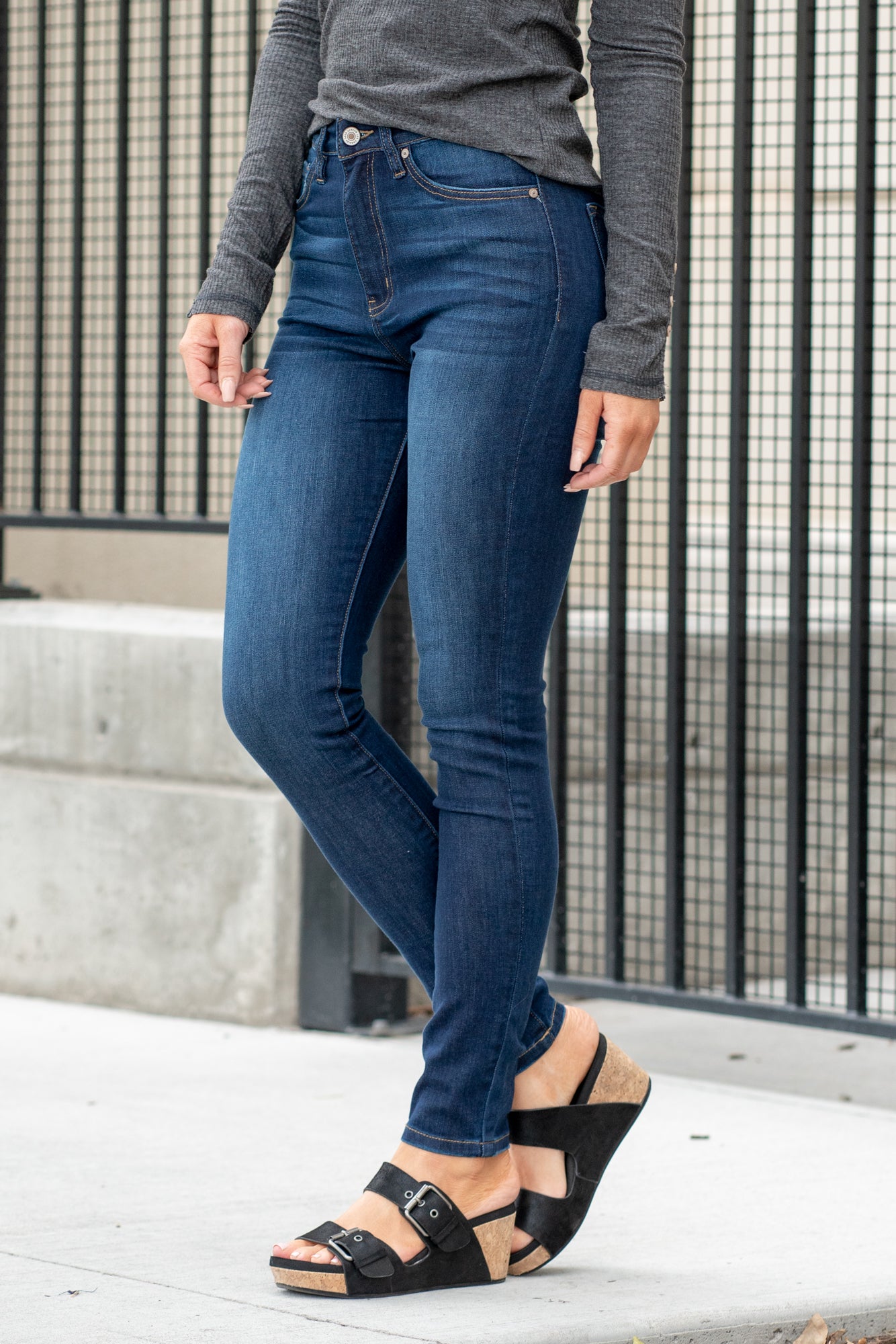 KanCan Jeans KanCan Comfort Stretch Color: Dark Blue Wash Cut: Skinny, 29.5" Inseam* Rise: High-Rise, 11.5" Front Rise* 68.9% COTTON , 22.9% POLYESTER , 7.1% RAYON , 1.1% SPANDEX Stitching: Classic Fly: Zipper Style #: KC7264RH Contact us for any additional measurements or sizing. *Measured on the smallest size, measurements may vary by size. Sarah wears a size 25 in jeans, a small in tops, and 8 in shoes. She is wearing size 25 in these jeans.