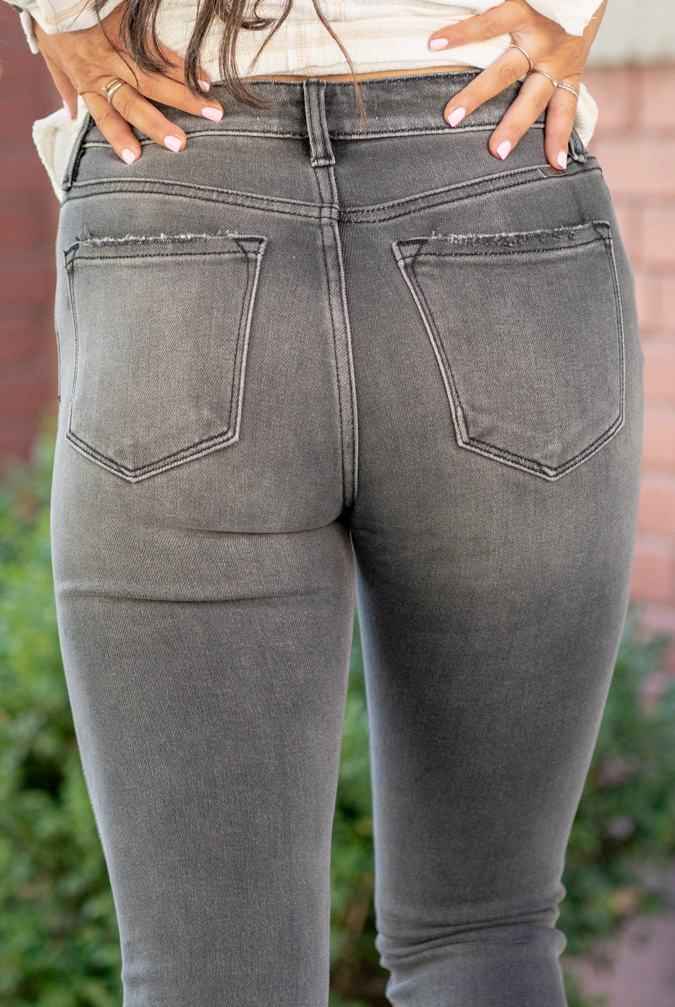 KanCan Jeans These high-rise gey wash skinny jeans have a slight distressed hem with a fitted skinny leg. Color: Grey Cut: Skinny, 29.5" Inseam Rise: High-Rise, 9.75" Front Rise 93% COTTON , 6% POLYESTER , 1% SPANDEX Stitching: Classic Fly: Zipper Style #: KC9134LG Contact us for any additional measurements or sizing. *Measured on the smallest size, measurements may vary by size. Jacquelyn wears a size 25 in jeans, a small in tops, and 6.5 in shoes. She is wearing a size 25 in these jeans.