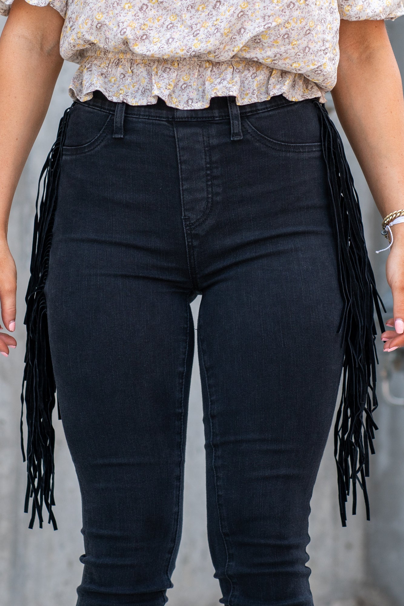 Judy Blue These pull-on jeggings have a fringe side detail and stretchy band waist. Carefully designed by Judy Blue to pull on and go. With a dark wash in black, these will be your new night-out jeans. Color: Black Cut: Pull-On Skinny, 28" Inseam* Rise: High-Rise, 10.75" Front Rise* Material: 52% Cotton, 22% Rayon, 23% Polyester, 3% Lycra Stitching: Classic Fly: Pull-On Style #: JB88497 | 88497 Contact us for any additional measurements or sizing.
