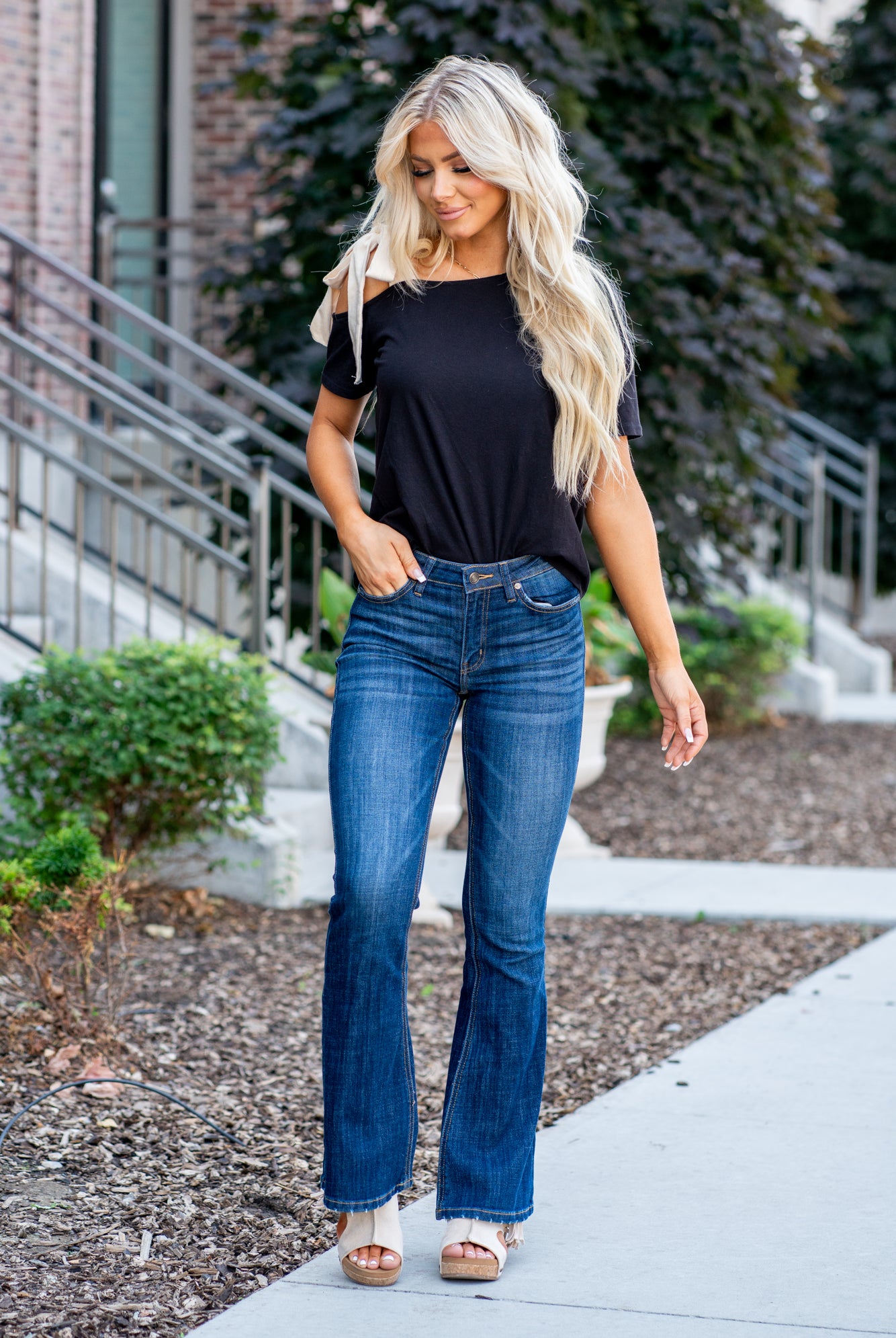 KanCan Jeans Collection: Core Style Color: Dark Wash Cut: Flare, 33.75" Inseam* Rise: Mid-Rise, 9" Front Rise* 54% 54% COTTON 34% Rayon 10% POLYESTER 2% SPANDEX Fly: Zipper Style #: KC6102LOH Contact us for any additional measurements or sizing. *Measured on the smallest size, measurements may vary by size. Cas is 5'7" and wears a size 25 in jeans, a small in tops, and 8 in shoes. She is wearing size 25 in these jeans.