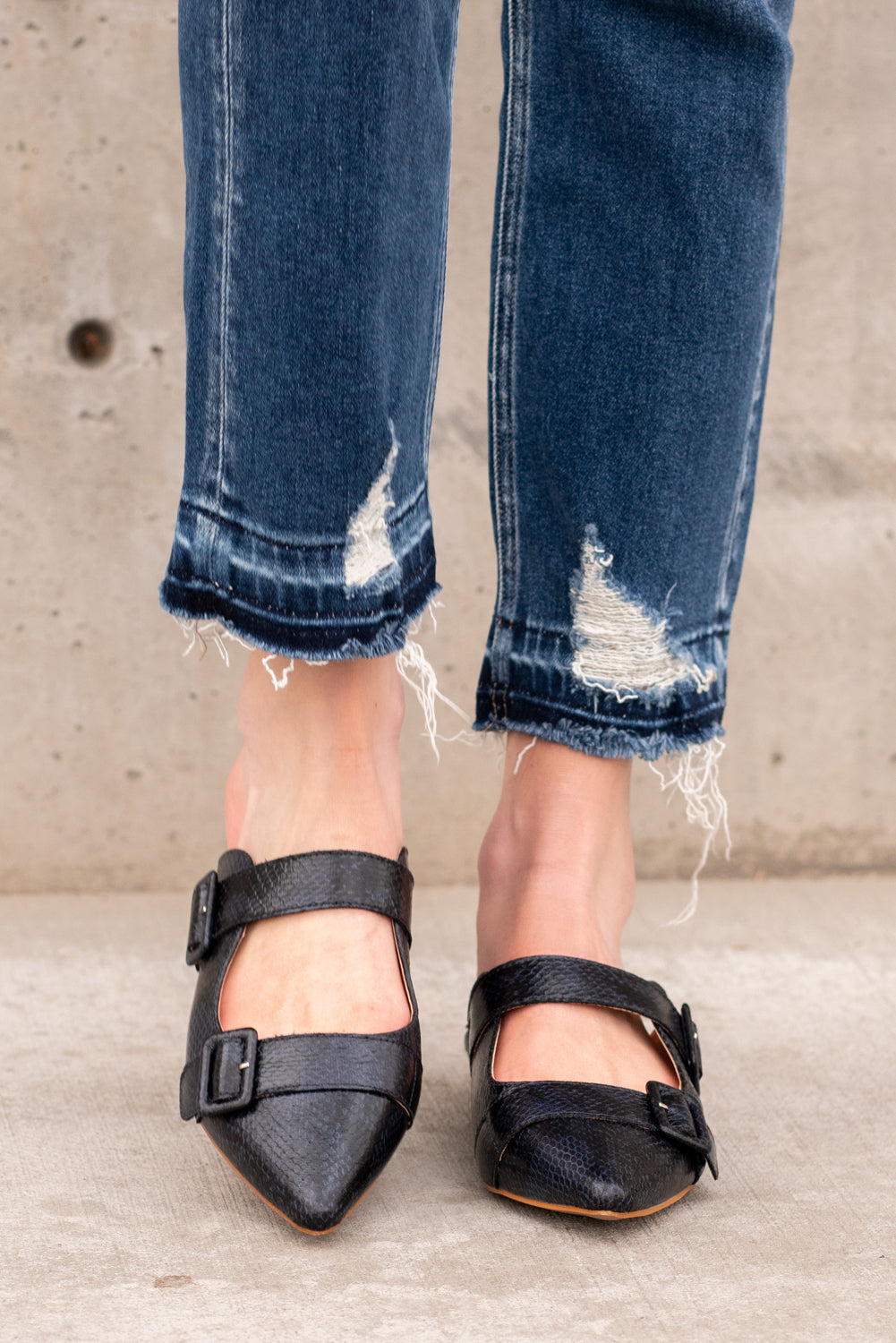 Flats by Mi.iM This creative slip on loafer adds a perfect amount of prep to any outfit! Buckles on the front give this slip on a fun pop of shine. Color: Navy Style Name: Hannah Man-made Leather Upper Genuine leather insole Heel Height: .5" Contact us for any additional measurements or sizing.