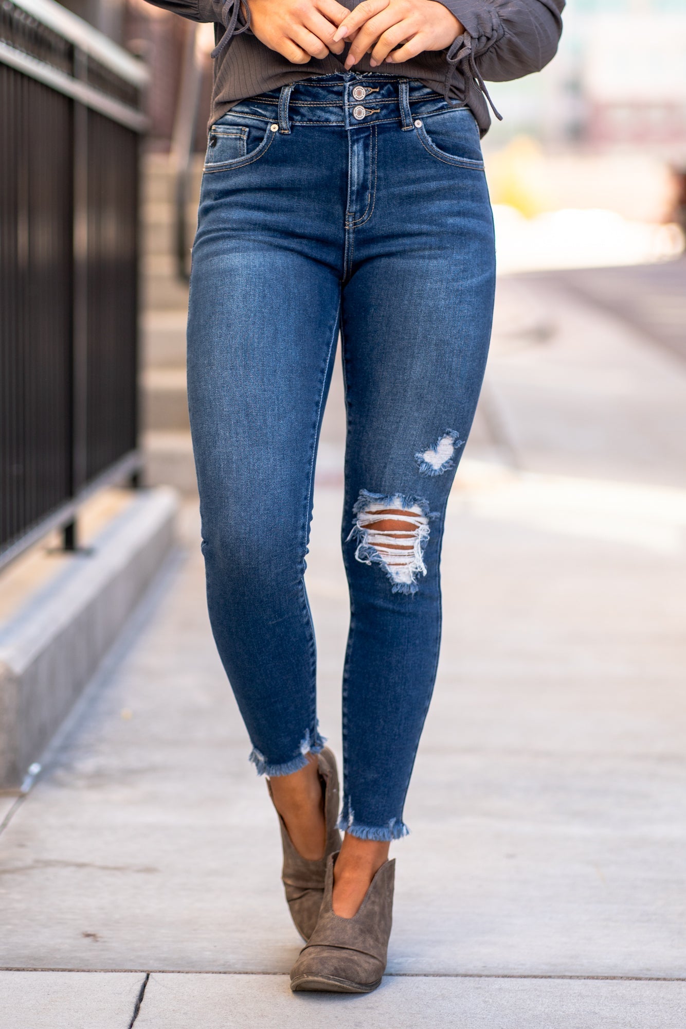 KanCan Jeans Color: Dark Wash Ankle Skinny, 27" Inseam* High Rise, 10" Front Rise* Frayed Hem Ankle with Ripped Distress 95% COTTON 4% POLY 1% LYCRA Fly: Zipper with Double Button Style #: KC8582D Contact us for any additional measurements or sizing. *Measured on the smallest size, measurements may vary by size.