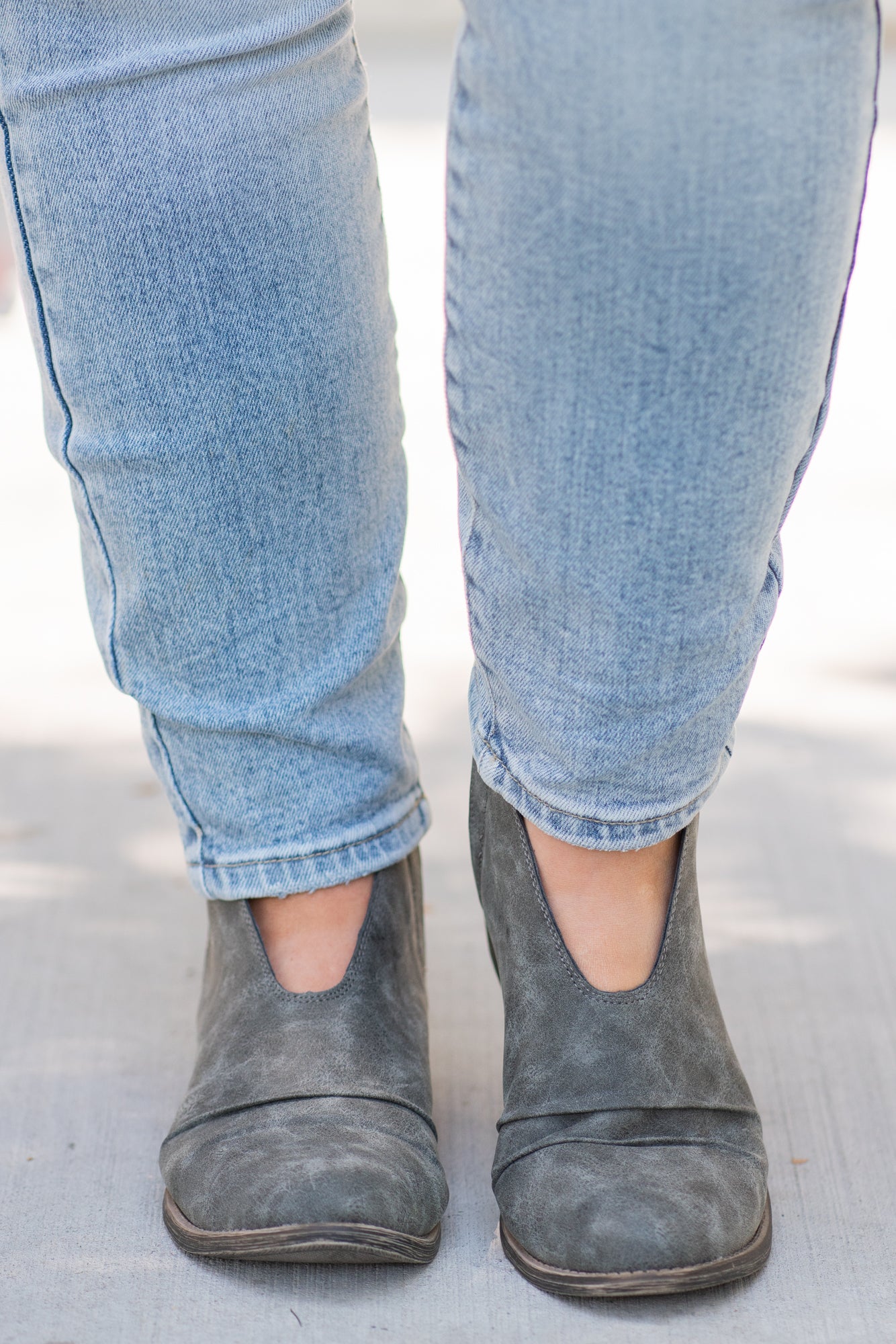 Booties | Very G These booties from Very G are perfect to wear with boot-cut jeans this fall. The look of a boot without the extra heat from a covered ankle. Style Name: Juliana Color: Grey Cut: Silp On Bootie Rubber Sole Style #: VGLB0277 Contact us for any additional measurements or sizing.