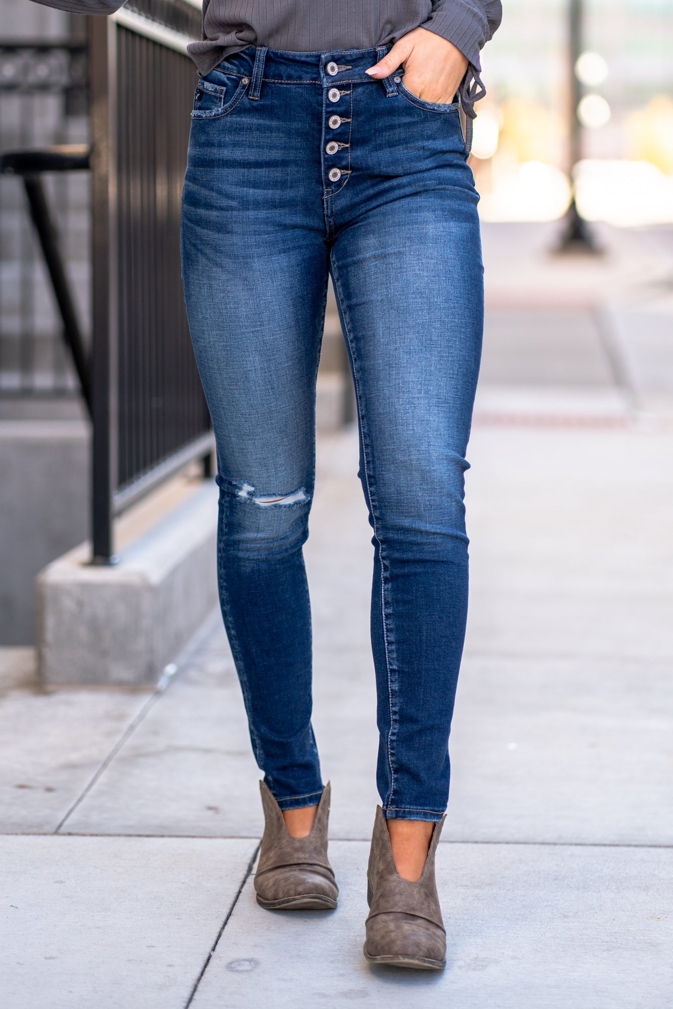 KanCan Jeans Color: Dark Wash Skinny, 29" Inseam* High Rise, 10" Front Rise* Frayed Hem Ankle with Ripped Distress 53.2% COTTON, 41.6% RAYON, 3.9% POLYESTER, 1.3% SPANDEX Fly: Zipper with Double Button Style #: KC7361D Contact us for any additional measurements or sizing. *Measured on the smallest size, measurements may vary by size.