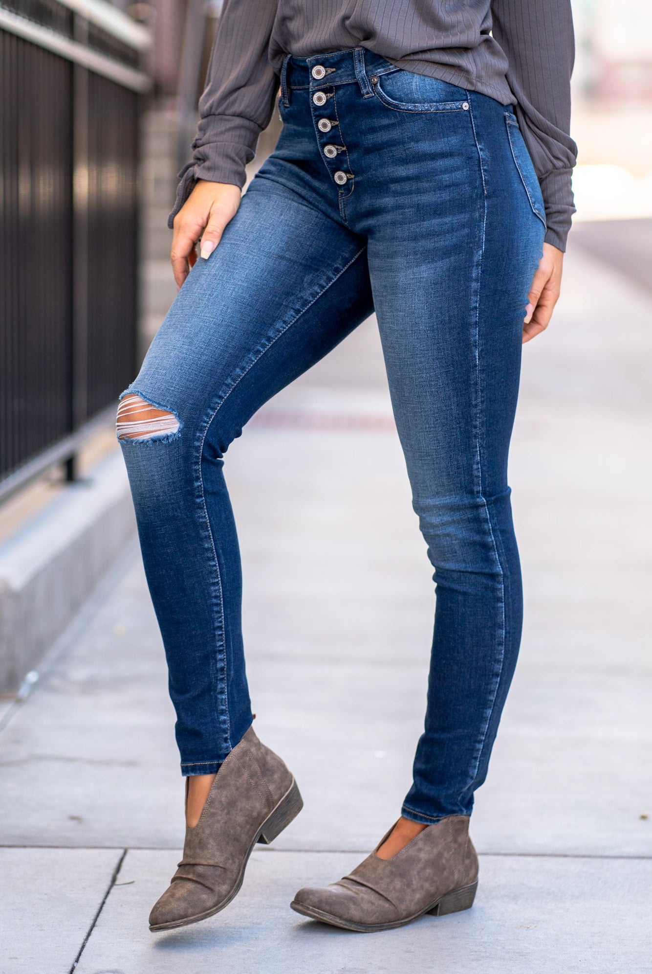 KanCan Jeans Color: Dark Wash Skinny, 29" Inseam* High Rise, 10" Front Rise* Frayed Hem Ankle with Ripped Distress 53.2% COTTON, 41.6% RAYON, 3.9% POLYESTER, 1.3% SPANDEX Fly: Zipper with Double Button Style #: KC7361D Contact us for any additional measurements or sizing. *Measured on the smallest size, measurements may vary by size.