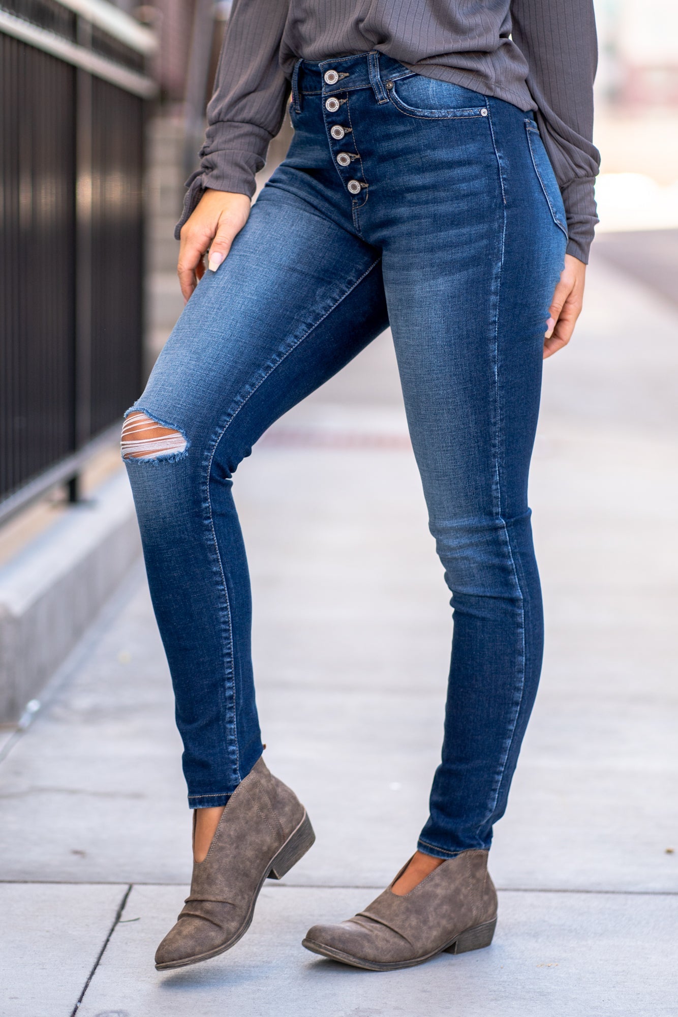 KanCan Jeans Color: Dark Wash Skinny, 29" Inseam* High Rise, 10" Front Rise* Frayed Hem Ankle with Ripped Distress 53.2% COTTON, 41.6% RAYON, 3.9% POLYESTER, 1.3% SPANDEX Fly: Zipper with Double Button Style #: KC7361D Contact us for any additional measurements or sizing. *Measured on the smallest size, measurements may vary by size.