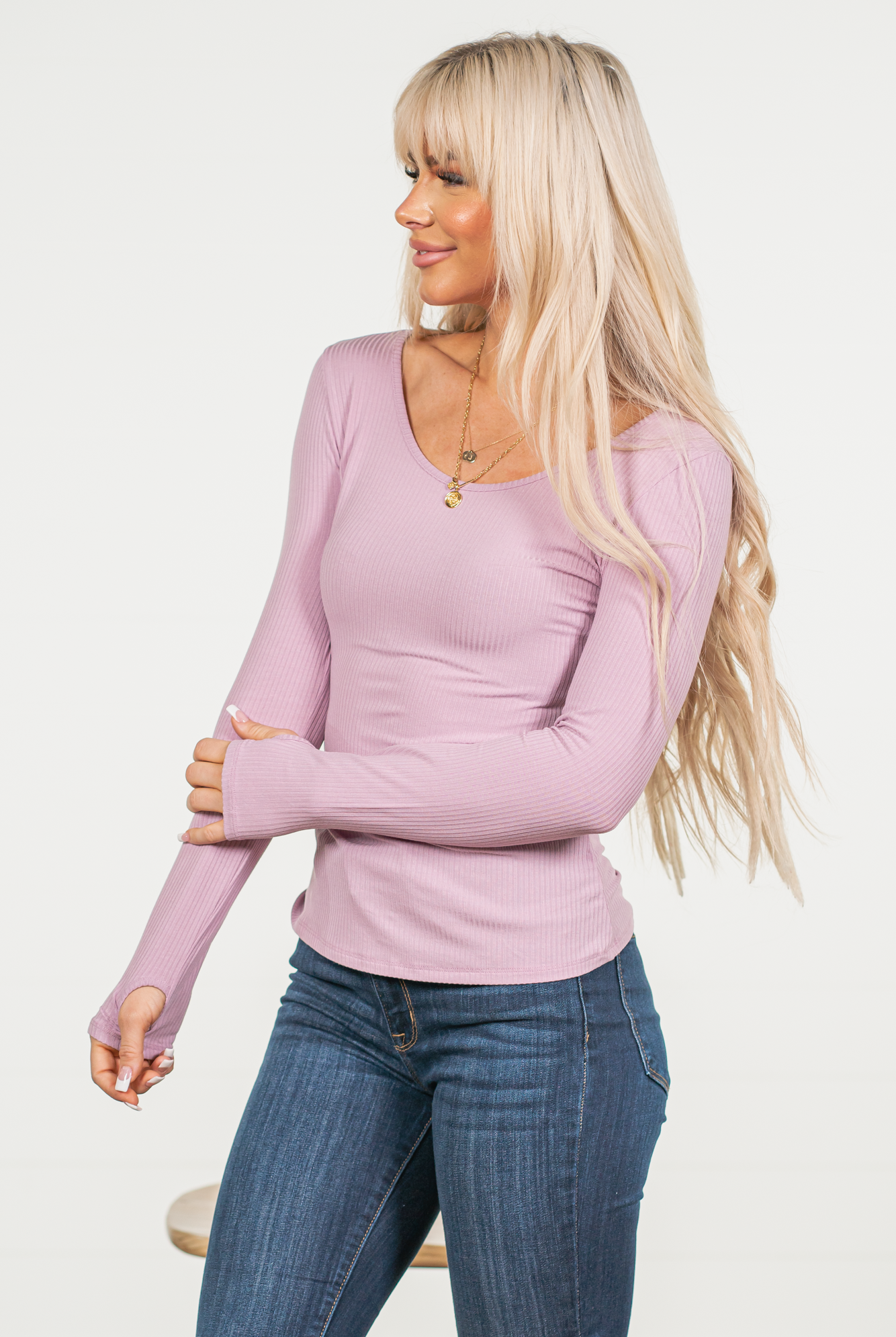 The perfect basic top to pair with your favorite jeans!  Color: Mauve Neckline: Round  Sleeve: Long, Thumb Holes 93% Rayon 7% Spandex  Style #: CWTTL296-Mauve Contact us for any additional measurements or sizing.        