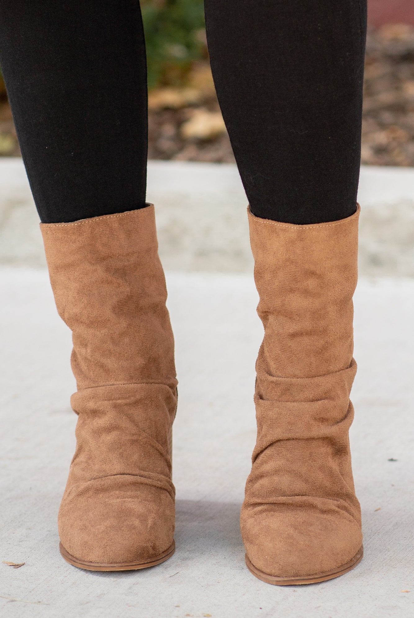 Boots by Oasis Society These scrunched boots with zipper closures and block heels are great with skinny jeans and oversized cardigans this fall. Color: Camel Man-made Upper Leather Wrap heel Padded footbed Shaft Height: 6.75" Heel Height: 3.25" Contact us for any additional measurements or sizing.