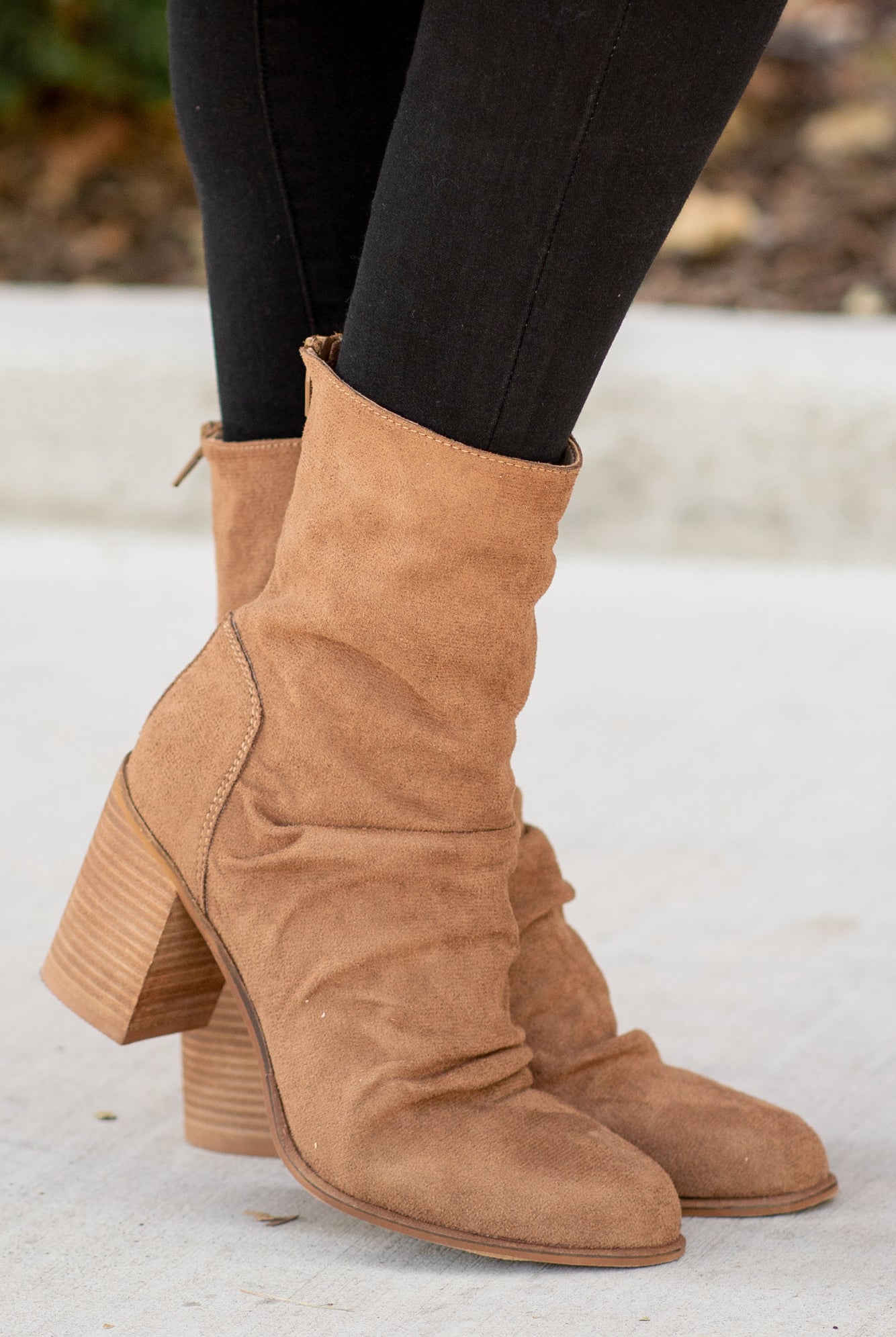 Boots by Oasis Society These scrunched boots with zipper closures and block heels are great with skinny jeans and oversized cardigans this fall. Color: Camel Man-made Upper Leather Wrap heel Padded footbed Shaft Height: 6.75" Heel Height: 3.25" Contact us for any additional measurements or sizing.