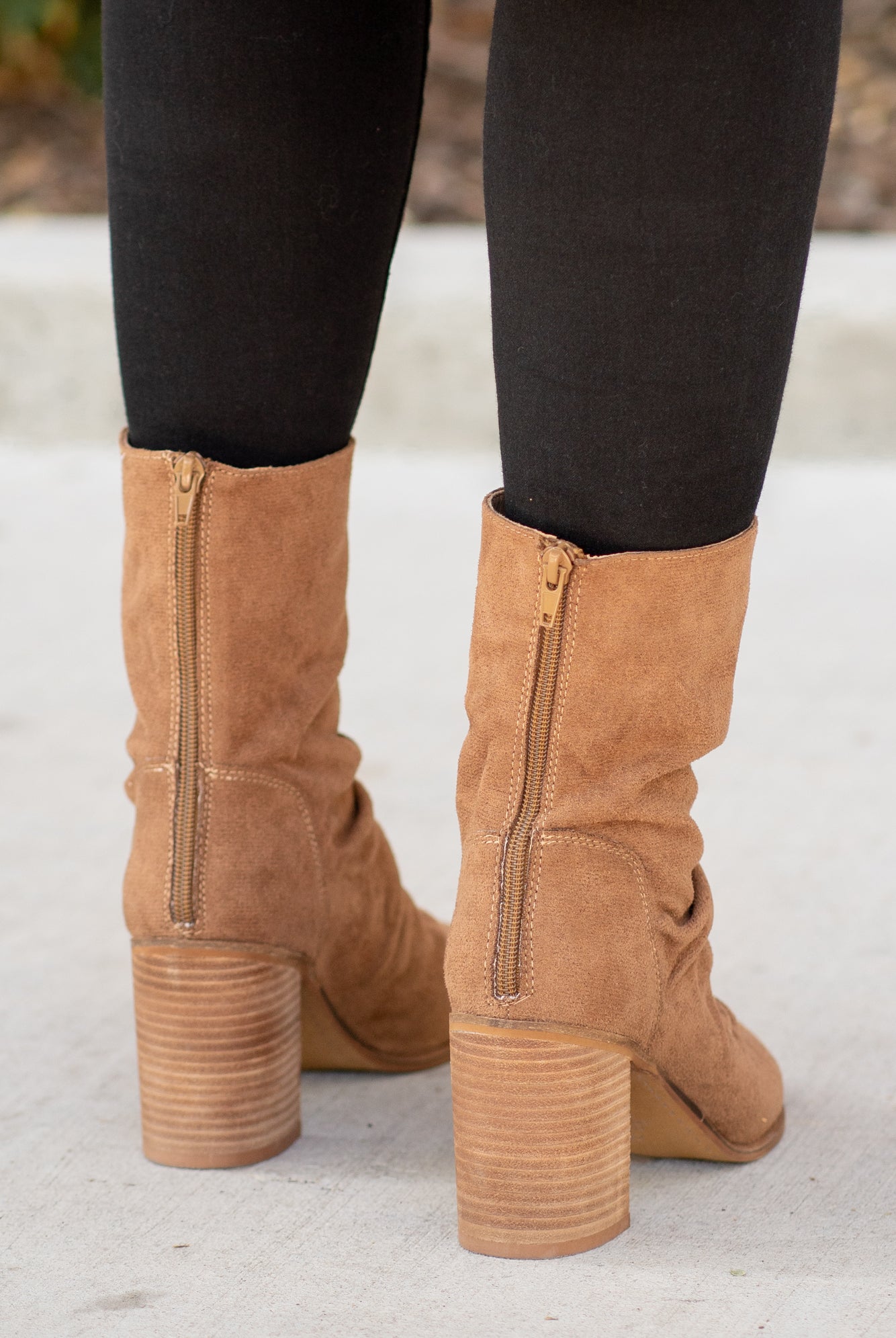 Boots by Oasis Society These scrunched boots with zipper closures and block heels are great with skinny jeans and oversized cardigans this fall. Color: Camel Man-made Upper Leather Wrap heel Padded footbed Shaft Height: 6.75" Heel Height: 3.25" Contact us for any additional measurements or sizing.