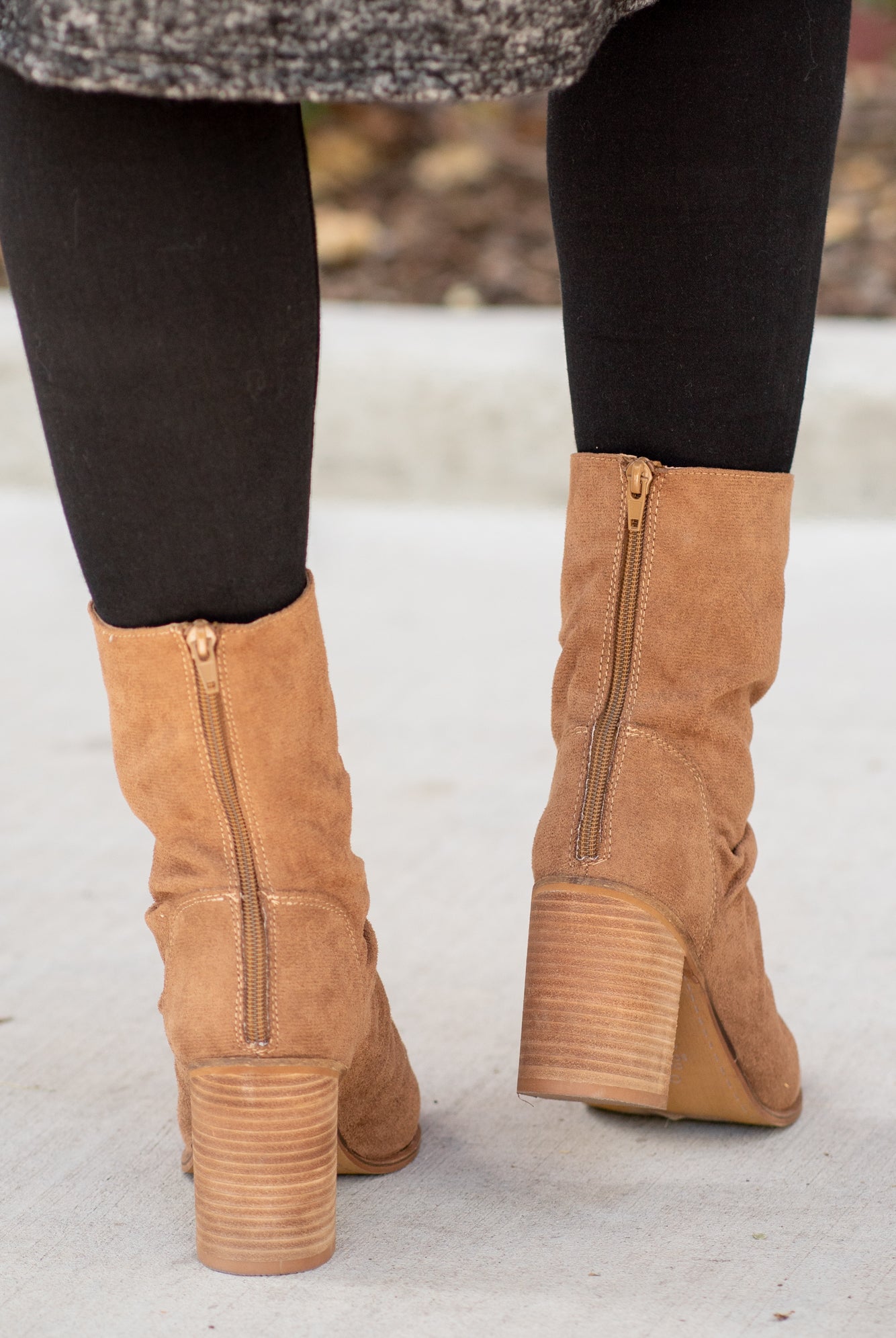 Boots by Oasis Society These scrunched boots with zipper closures and block heels are great with skinny jeans and oversized cardigans this fall. Color: Camel Man-made Upper Leather Wrap heel Padded footbed Shaft Height: 6.75" Heel Height: 3.25" Contact us for any additional measurements or sizing.