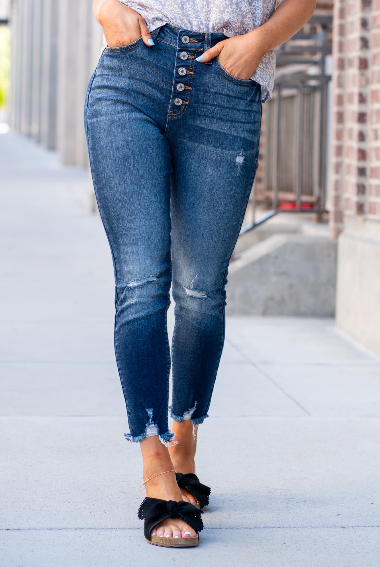 KanCan Jeans Collection: Core Style Style Name: Geneva Color: Dark Wash Cut: Ankle Skinny, 27" Inseam* Rise: High-Rise, 11" Front Rise* 73% Cotton 14% Rayon 11% Polyester 2% Lycra Fly: Exposed Button Fly Style #: KC8423D Contact us for any additional measurements or sizing. *Measured on the smallest size, measurements may vary by si