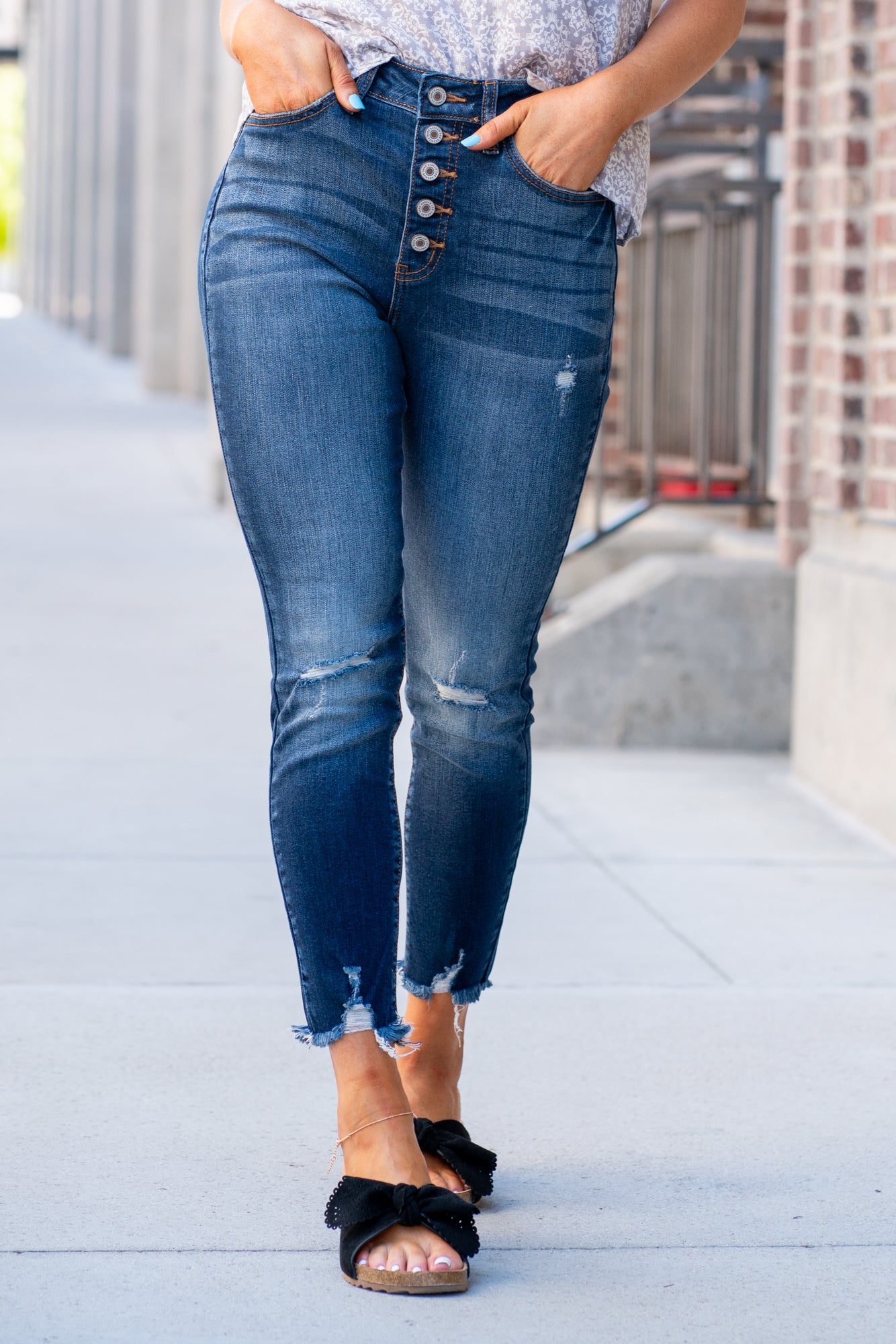 KanCan Jeans Collection: Core Style Style Name: Geneva Color: Dark Wash Cut: Ankle Skinny, 27" Inseam* Rise: High-Rise, 11" Front Rise* 73% Cotton 14% Rayon 11% Polyester 2% Lycra Fly: Exposed Button Fly Style #: KC8423D Contact us for any additional measurements or sizing. *Measured on the smallest size, measurements may vary by si